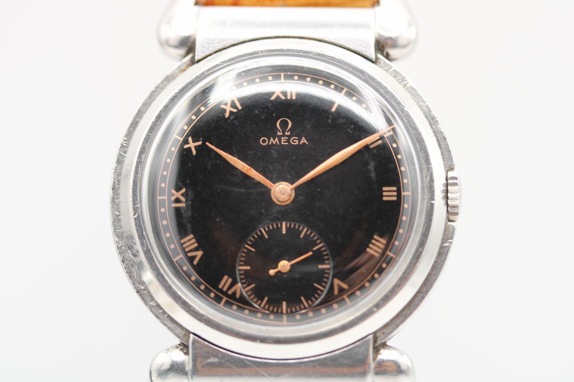 A rare find vintage Omega Bullhorn lug watch from 1936. In fine working order this vintage piece is in excellent all round condition. Rare black Gilt dial that appears in fine original order. Bronze coloured hands and roman numeral hour markers with