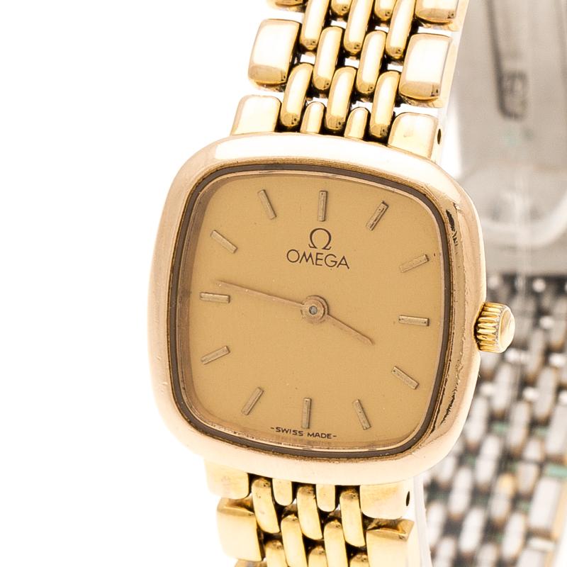 This De Ville wristwatch from Omega will beautify your look by adding just the right touch of luxury. Crafted from gold-plated stainless steel, its case supports a smooth bezel and a simple dial housing gold-tone hour indexes, hands, and the brand