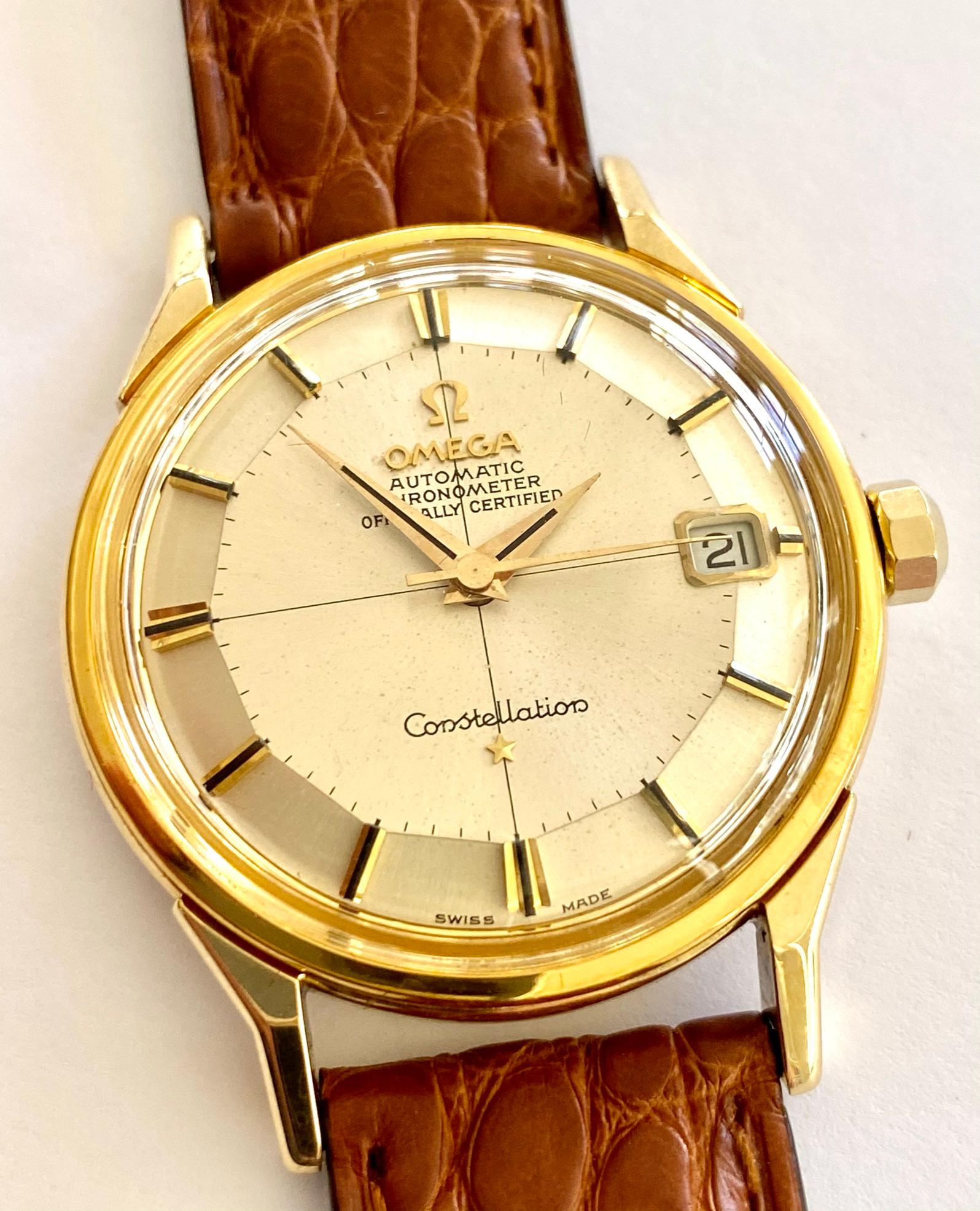 18K. yellow Gold Omega Constellation Watch with a  brown leather strap
model nr: BA 168.005  
Automatic chronometer calibre 561, with date, twelve-sided silvered dial, inner minute circle with strokes, polished and riveted gold hour markers with a