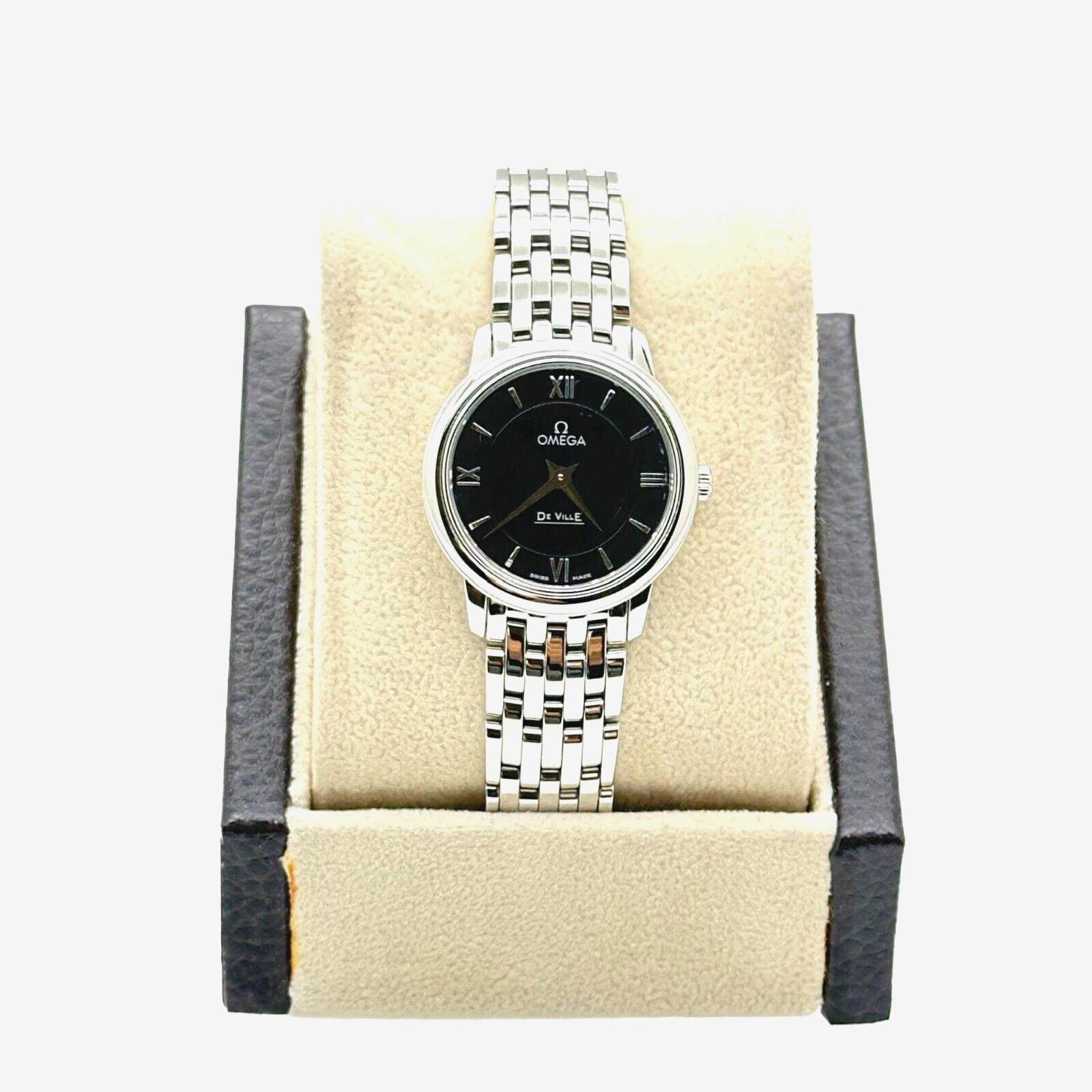
Style Number: 424.10.27.60.01.001

Model: DeVille Prestige 

Case Material: Stainless Steel 

Band: Stainless Steel 

Bezel:  Stainless Steel 

Dial: Black

Face: Sapphire Crystal 

Case Size: 24.4mm

Includes: 

-Omega Box and Paper

-Certified