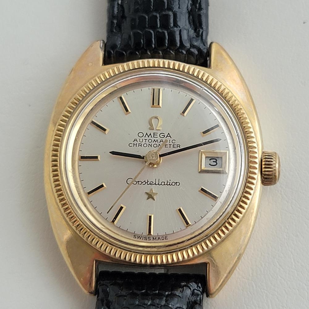 Classic luxury, Ladies Omega Constellation gold-capped date automatic with 18k solid gold bezel, c.1960s in pristine vintage condition. Verified authentic by a master watchmaker. Omega signed cream dial, applied baton hour markers, gilt black