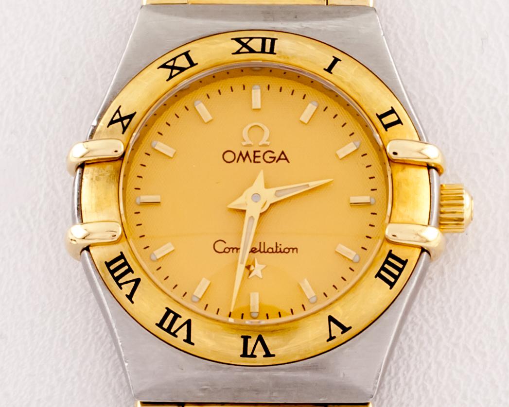 Omega Ladies Constellation Quartz Two-Tone SS 18k Gold Watch 795/1203
Movement #1456
Case #795/1203
Serial Number: 58092516
Production Year: 1998
Stainless Steel and 18k Yellow Gold Case
Features Brushed Tonneau Stainless Steel Case w/ 18k Yellow