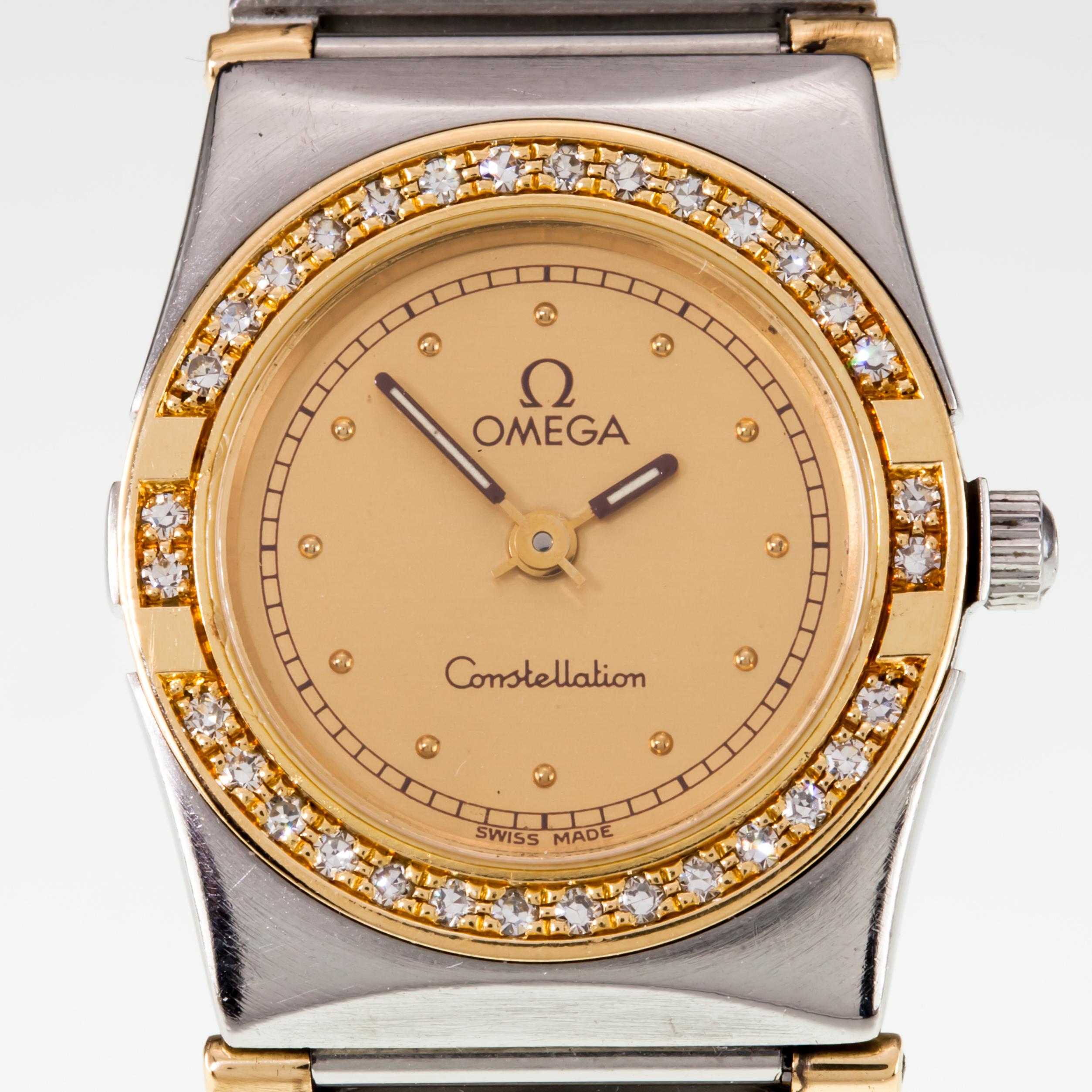 Omega Ladies Mini Constellation Two-Tone Quartz Watch w/ Diamonds
Movement #1455.976001
Case #8951080
Stainless Steel Case w/ 18k Yellow Gold Diamond Bezel
22 mm in Diameter (24 mm w/ Crown)
Lug-to-Lug Width = 16 mm
Lug-to-Lug Distance = 25 mm
Gold