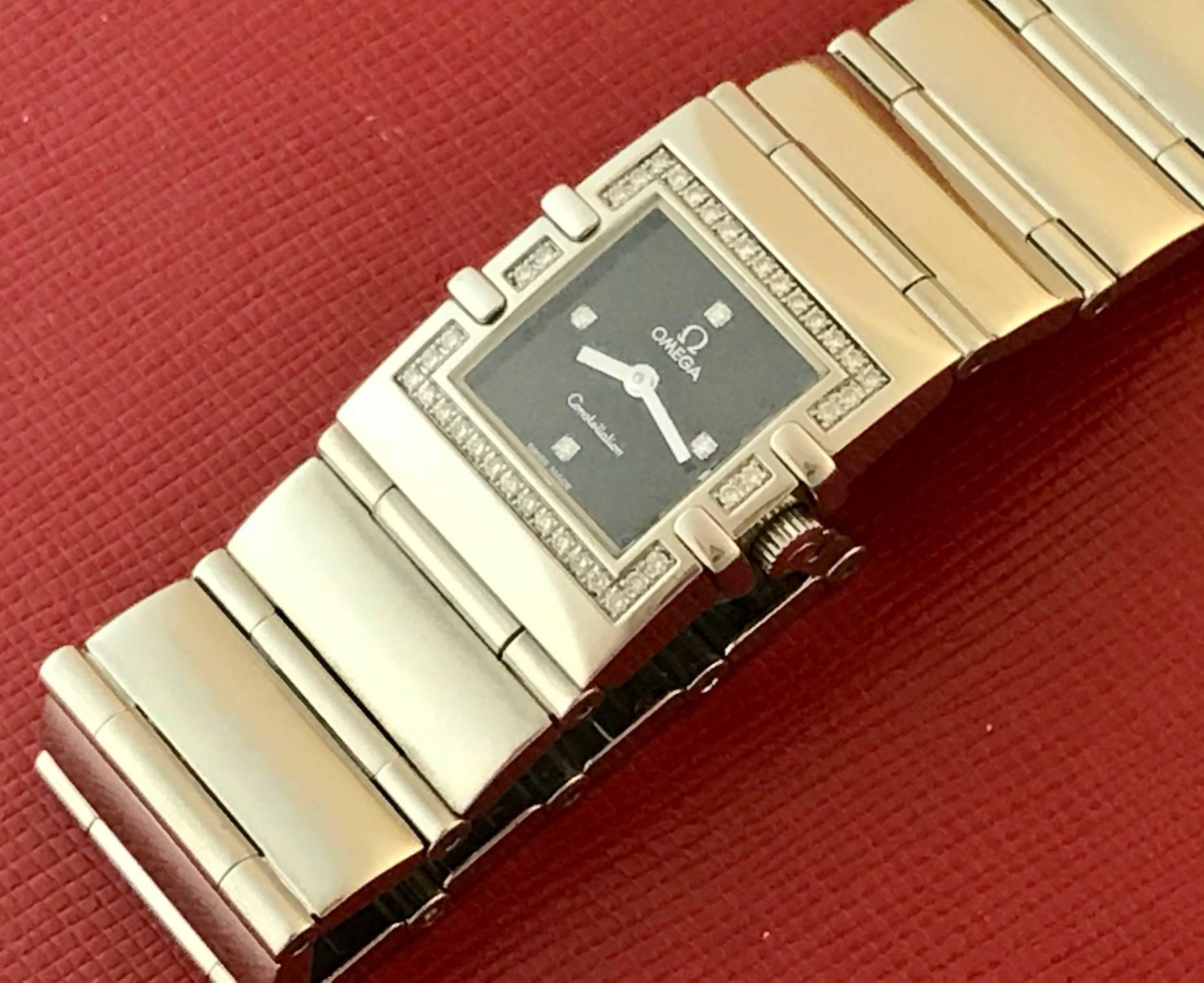 Omega Constellation Quadra ladies quartz pre-owned wrist watch. This beautiful classic Omega features a black dial with diamond hour markers and classic stainless steel case with diamond bezel. Measures 19mm x 25mm. This watch is in pristine