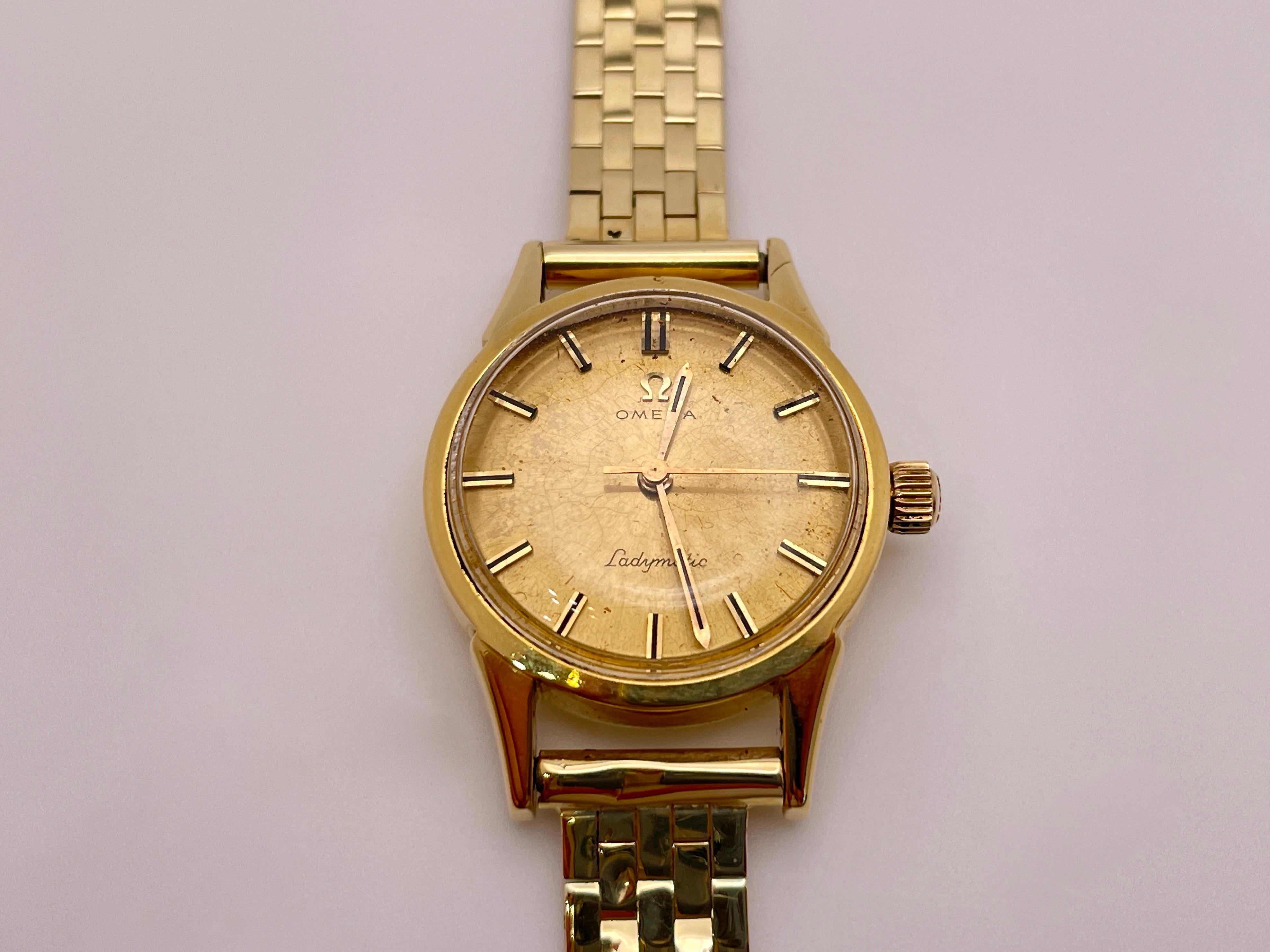 Vintage Omega Ladymatic 14K Yellow Gold Self-Winding Women's Watch - A Timeless Treasure

Experience the elegance and sophistication of the Omega Ladymatic Self-Winding Women's Watch. Crafted from 14K yellow gold, this vintage timepiece beautifully