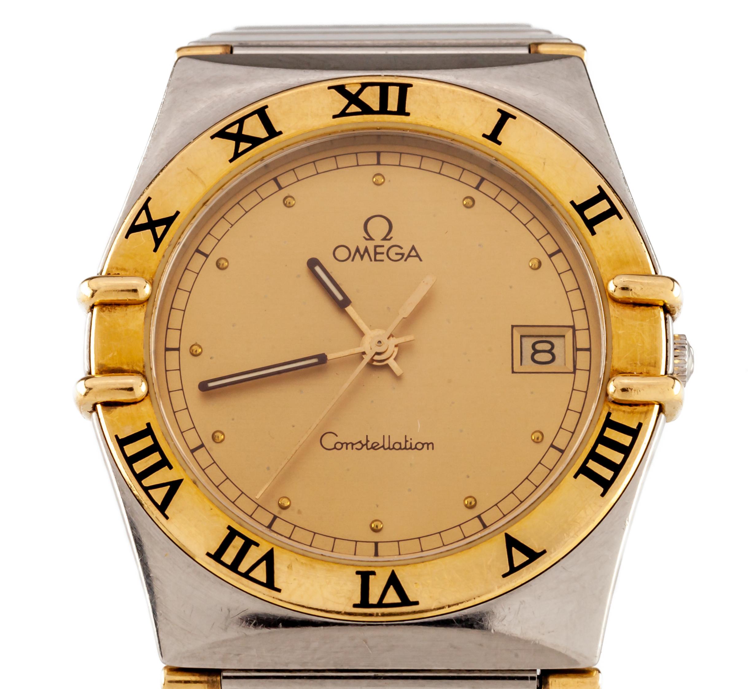 
Omega Men's Quartz Two-Tone Constellation Watch w/ Date
Movement #255461
Case #53169630
Stainless Steel Case w/ 18k Gold Roman Numeral Bezel
33 mm in Diameter (34 mm w/ Crown)
Lug-to-Lug Distance = 37 mm
Lug-to-Lug Width = 23 mm
Thickness = 6