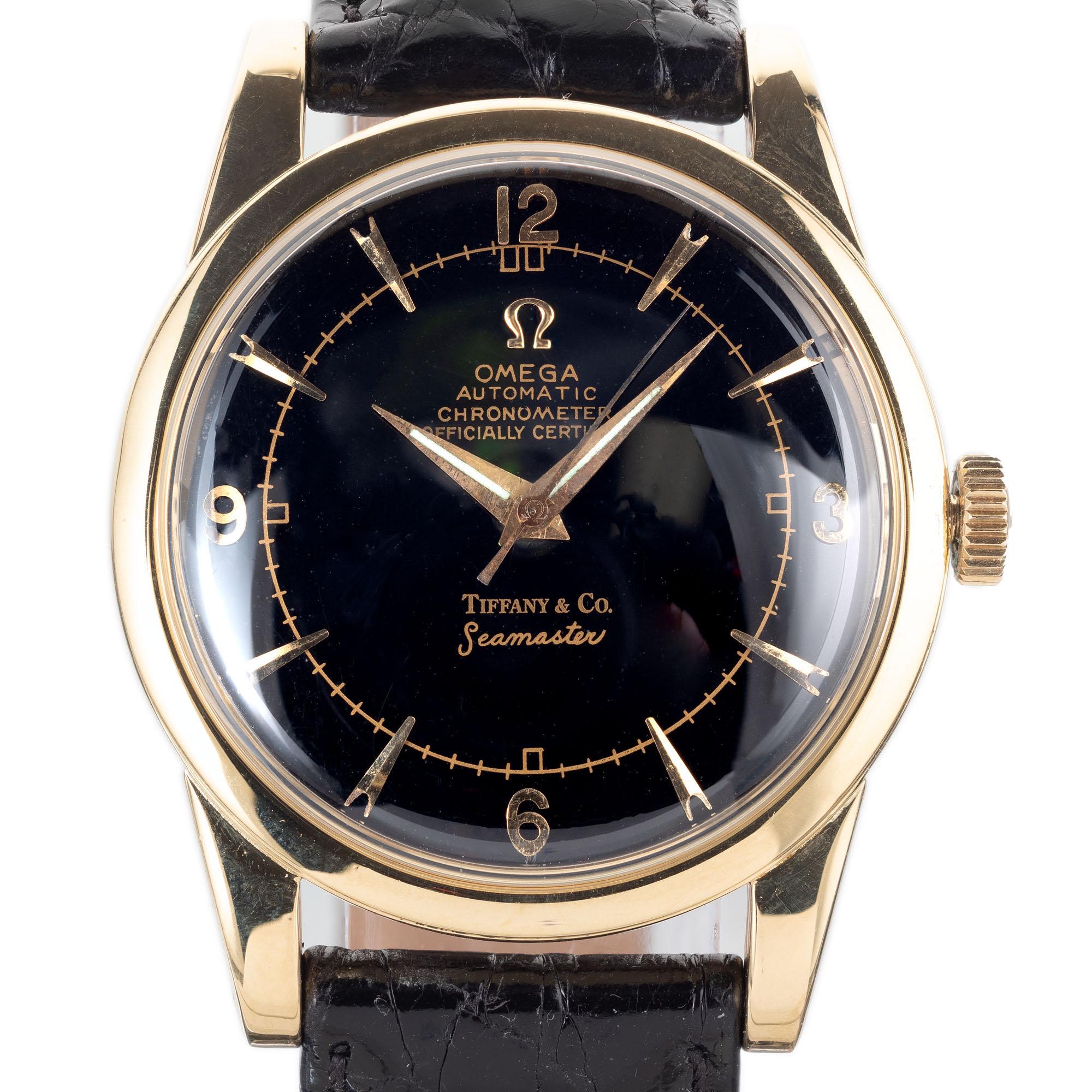 Vintage 1950's Omega 18k yellow gold 2520 wristwatch. Caliber 352 automatic certified chronometer movement. Seamaster retailed by Tiffany & Co. Original dial may have been refinished in the past.

Length: 42.35mm
Width: 34mm
Band width at case: