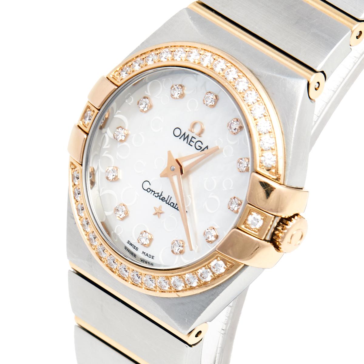 An icon from Omega, this Constellation Quartz watch for women is cast in stainless steel and 18 yellow gold. It has diamonds on the bezel and a mother of pearl dial that holds our gaze. Set on the round dial are two gold hands and diamond hour