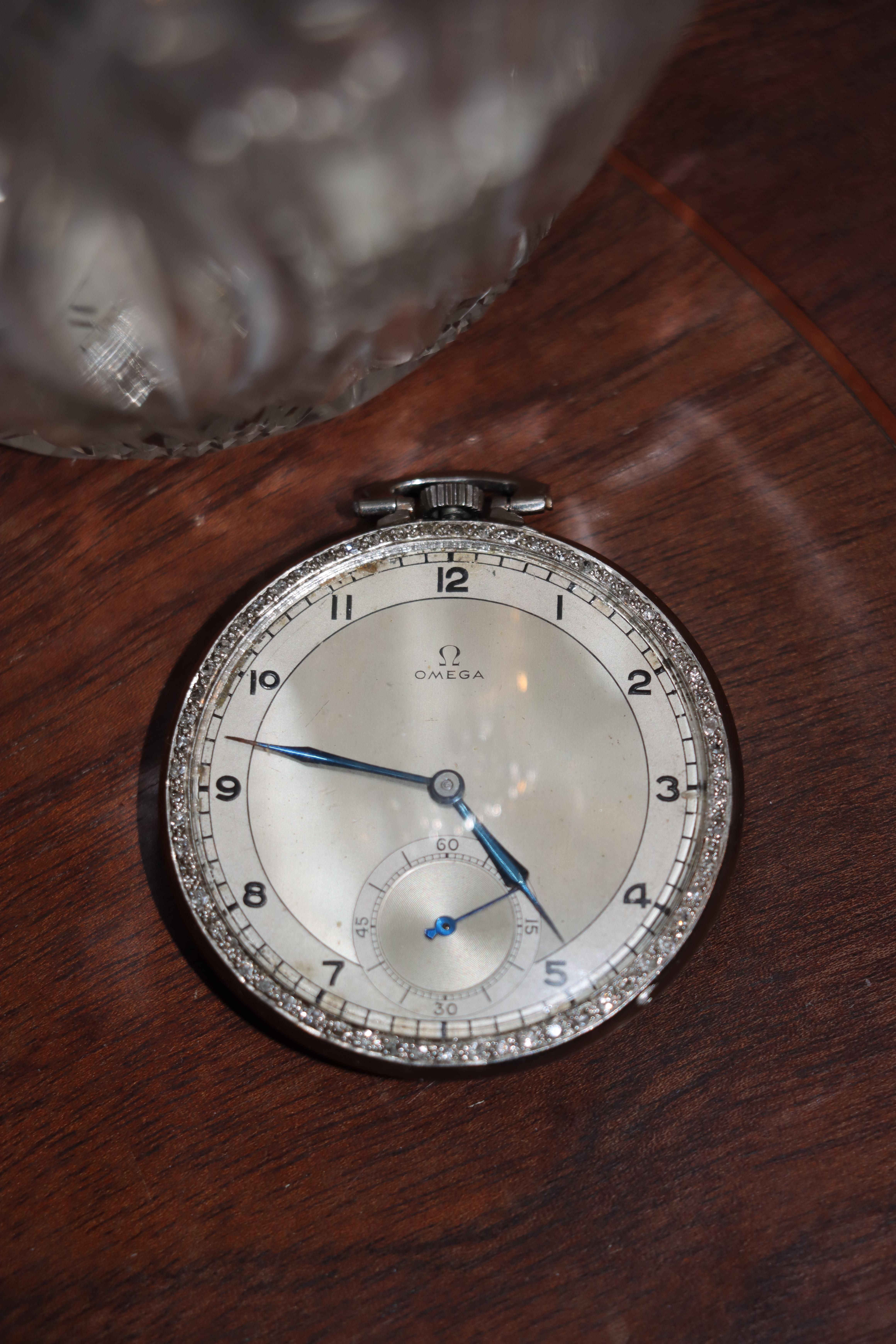 OMEGA Platinum Diamond Pocket Watch

Approximate Dimensions:
5.2 cm (Length)
39 mm (Dial)
4.5 cm (Diameter)
45.1 gram in Weight.