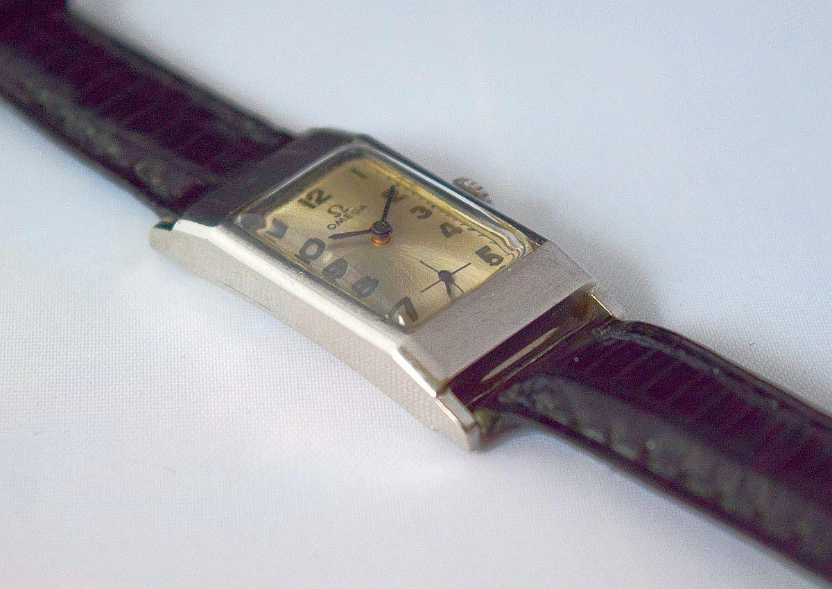 Omega Rectangular Unique Watch Steel cased  Rare Example.
Lovely Domed top Original glass with slightly Curved Case.
Very Rare and Stylish watch from the 1940's.
Dial Is light silver with Gold numbers circled in black.
Dial Is Signed Omega and Omega