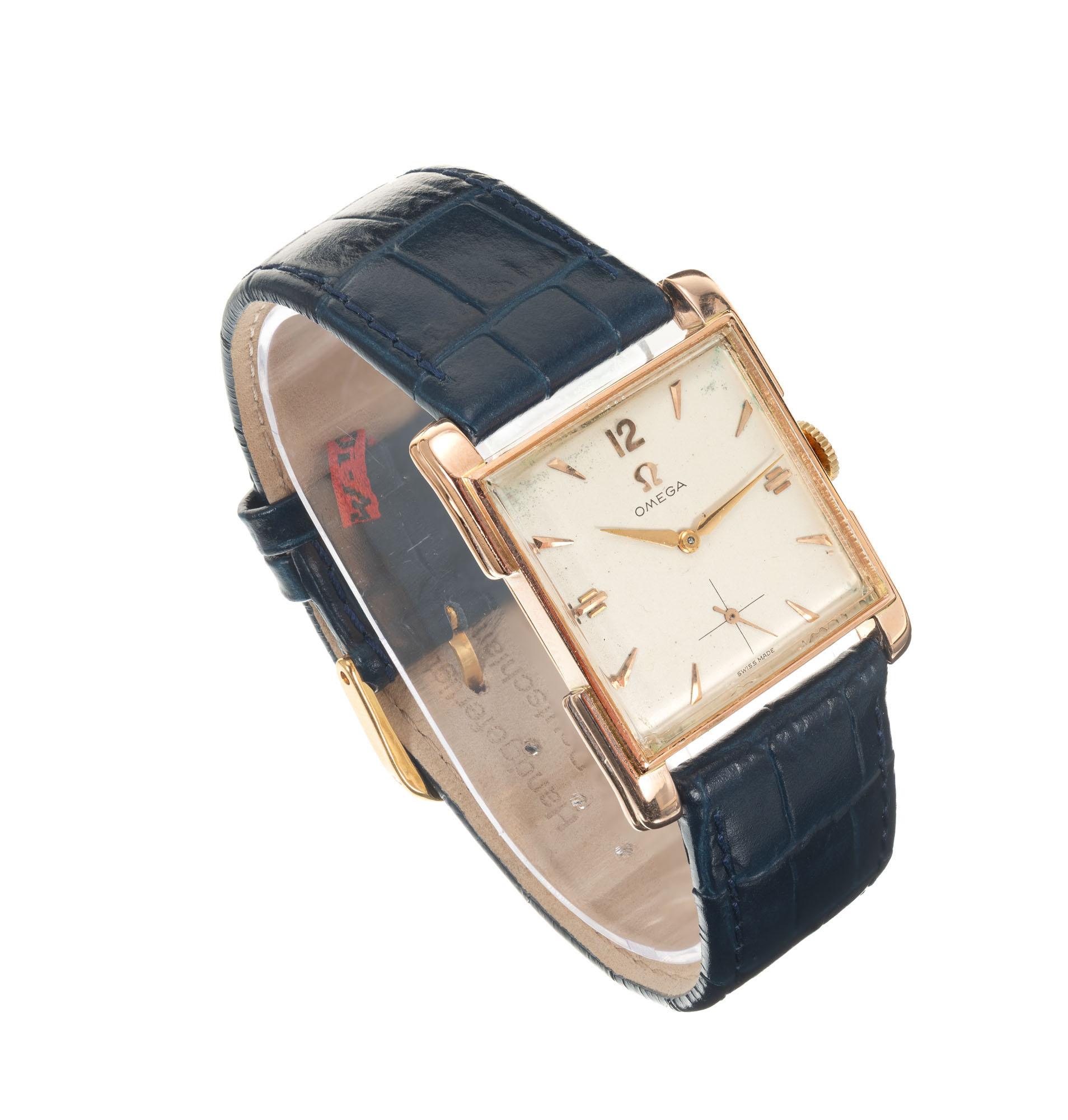 Mens Omega 194o's 14 Rose Gold manual wind 17 jewel wristwatch. Rectangular retro design case 

Length: 34.19mm
Width: 25.71mm
Band width at case: 20mm
Case thickness: 6.51mm
Band: blue leather new
Crystal: Acrylic
Dial: Parchment 
Inside case: 14k