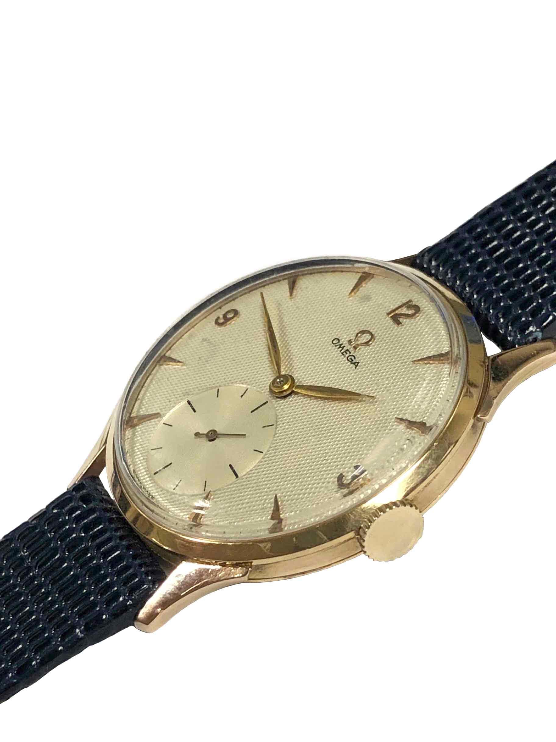 Circa 1940s Omega Wrist Watch, 36 M.M. 3 Piece 18K Rose Gold Case with curved Lugs for the South American market. 17 Jewel, mechanical, manual wind movement. Professionally restored Silver Satin Waffle textured dial with raised Markers and an Engine