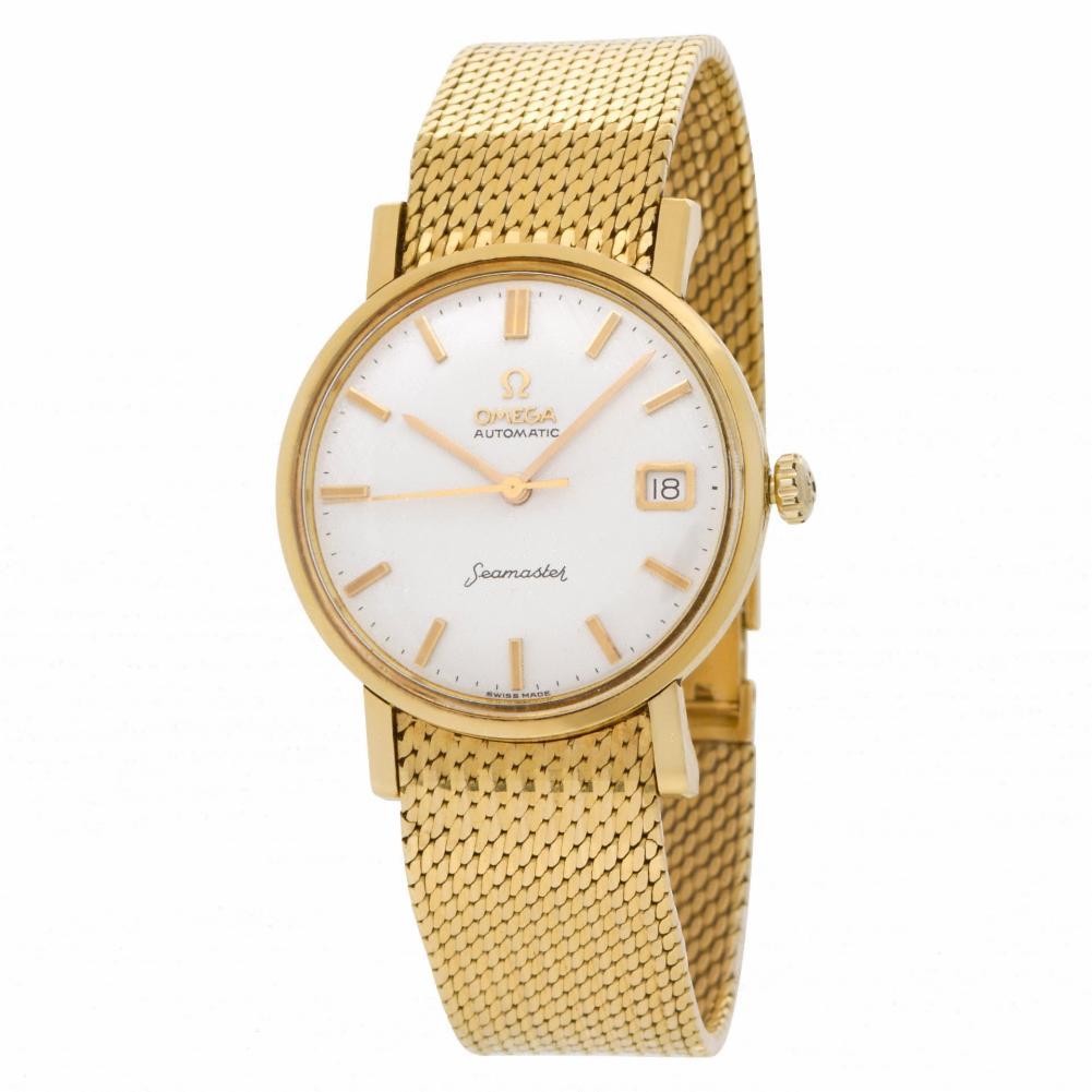 Omega Seamaster with Linen dial in 18k yellow gold on a mesh bracelet in 18k yellow gold, fits 7.75'' wrist size. Auto w/ sweep seconds and date. 34 mm case size. Ref 14743 SC-62. Circa 1970. Fine Pre-owned Omega Watch. Certified preowned Classic