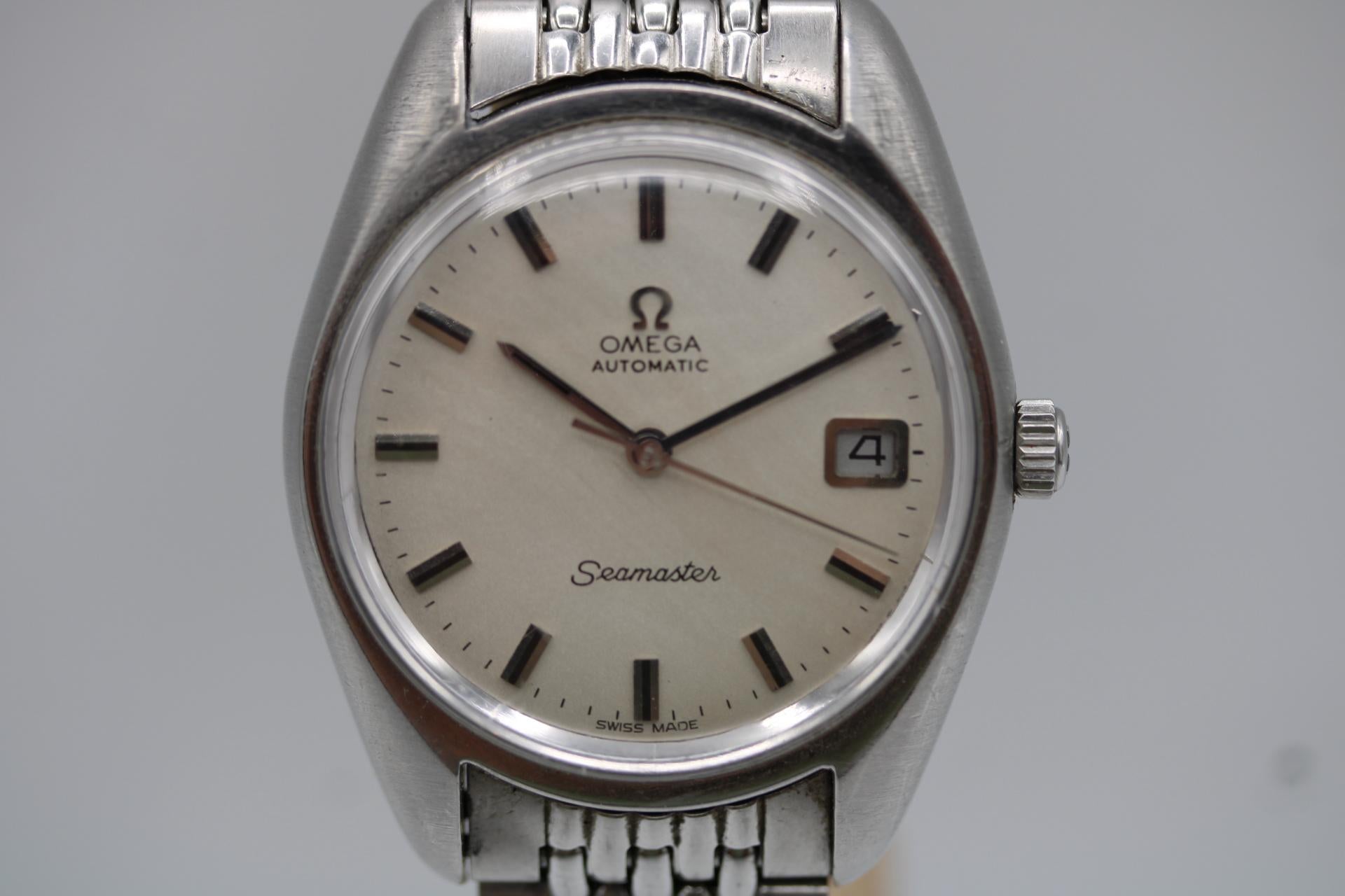 Omega Seamaster 166.067  Silver Dial  1970  Vintage Automatic
A stunning example of 1970s design, this Omega Seamaster 166.067 combines vintage charm with an affordable price tag—all under £1000. Featuring the iconic cushion-shaped case and a clean