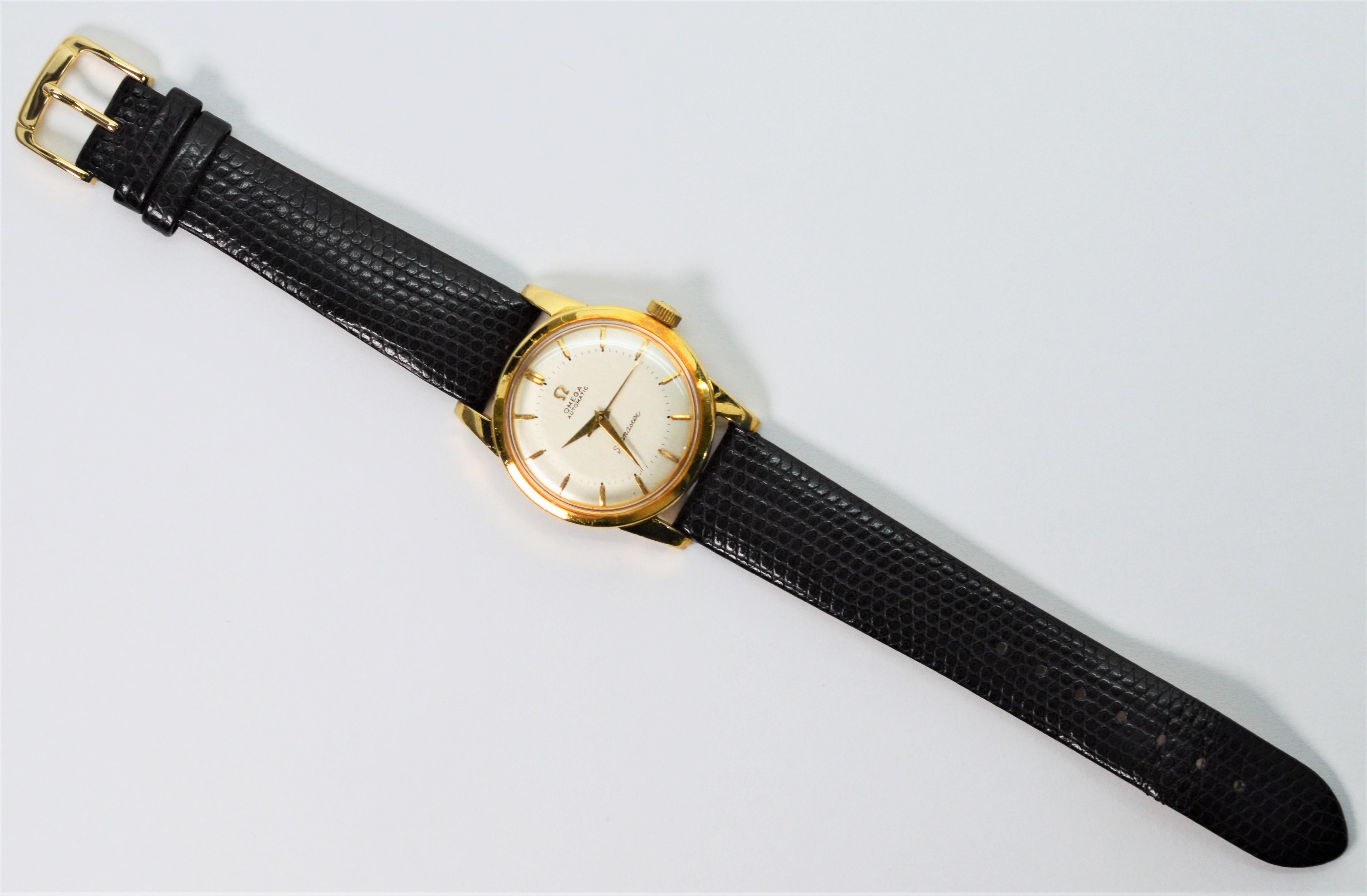 A classic collectable timepiece. Enjoy this dependable 18K yellow gold Omega 351 Men's automatic bumper wrist watch.
Set up with a new Speidel black crocodile strap, this fine 34mm gold Omega Seamaster watch number 13065932 has a silver-toned face