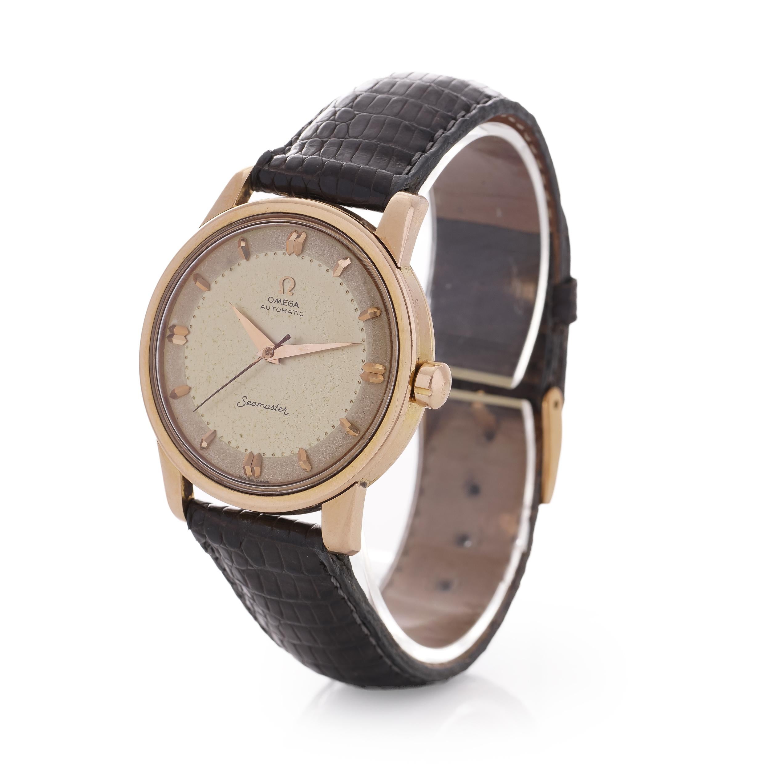 Omega Seamaster Automatic  Vintage 18kt. pink gold Cal.501 men's wristwatch. 

Period: 1956 
Movement: 20 jewels, Automatic 
Calibre: 501 
Hour Markers:  'Diamond' Markers and 'Dauphine' Style Hands
Case Material: 18 KT GOLD
Dial colour: Gold 
Case