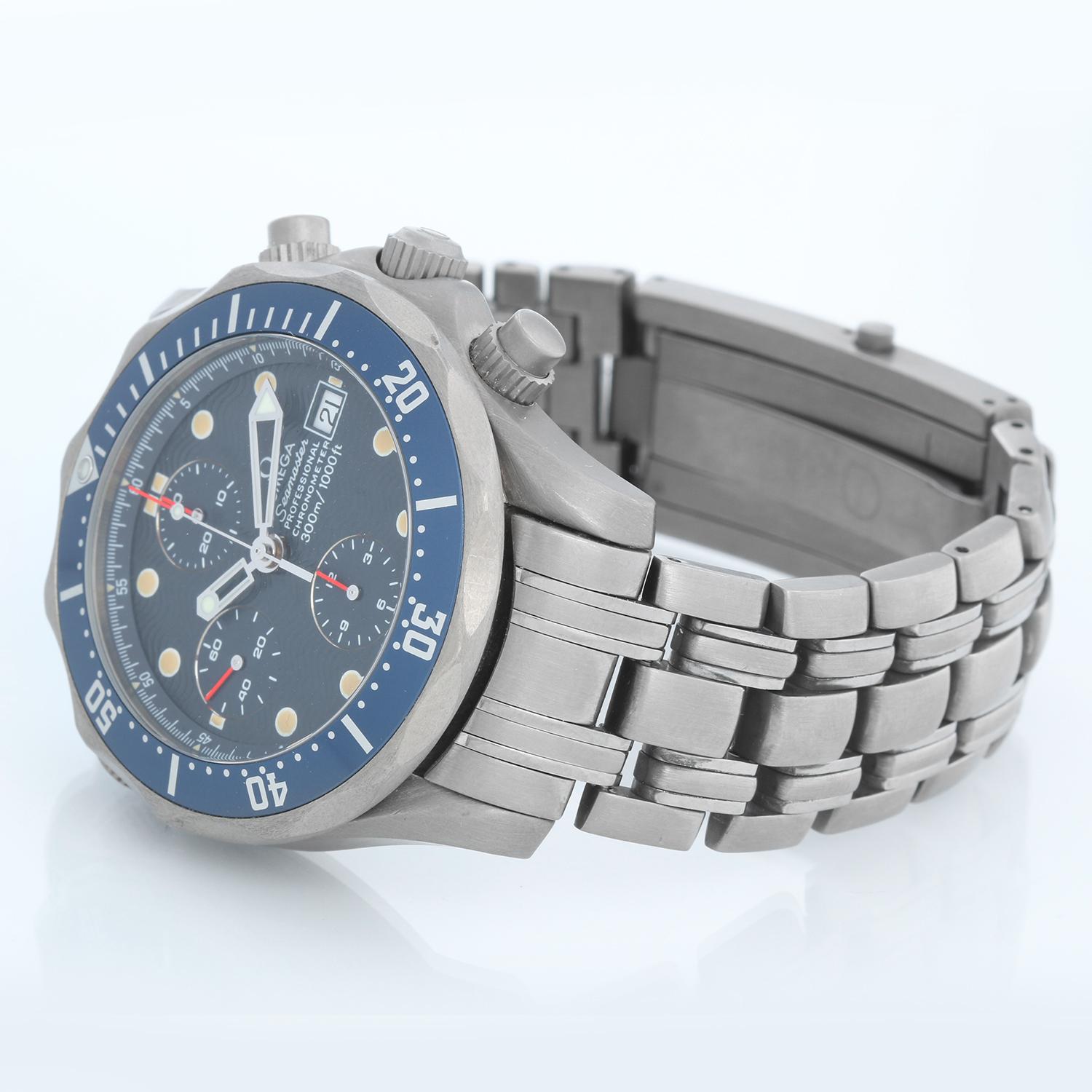 Omega Seamaster Chronograph Blue Dial Titanium Watch 2298.80.00 - Automatic winding. Titanium case (42 mm ) . Blue wave dial with luminous skeleton hands and hour markers. Date window at 3 o'clock. Titanium bracelet with double folding clasp; will