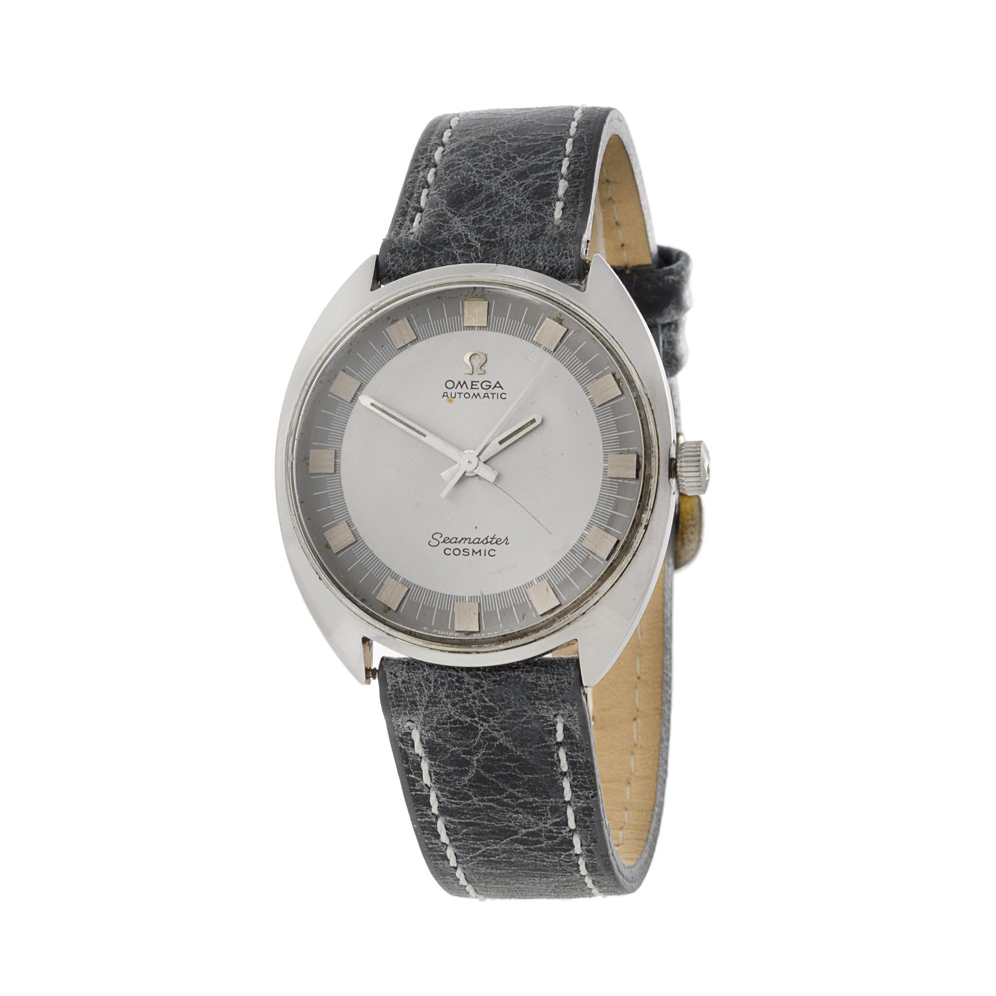 This is a nice condition Omega Cosmic Seamaster Reference 165.026 from 1966. This watch has a rare grey two tone dial. It is powered by an automatic caliber 552 movement. 

The steel case of this watch measures 35mm and is unpolished. The Cosmic