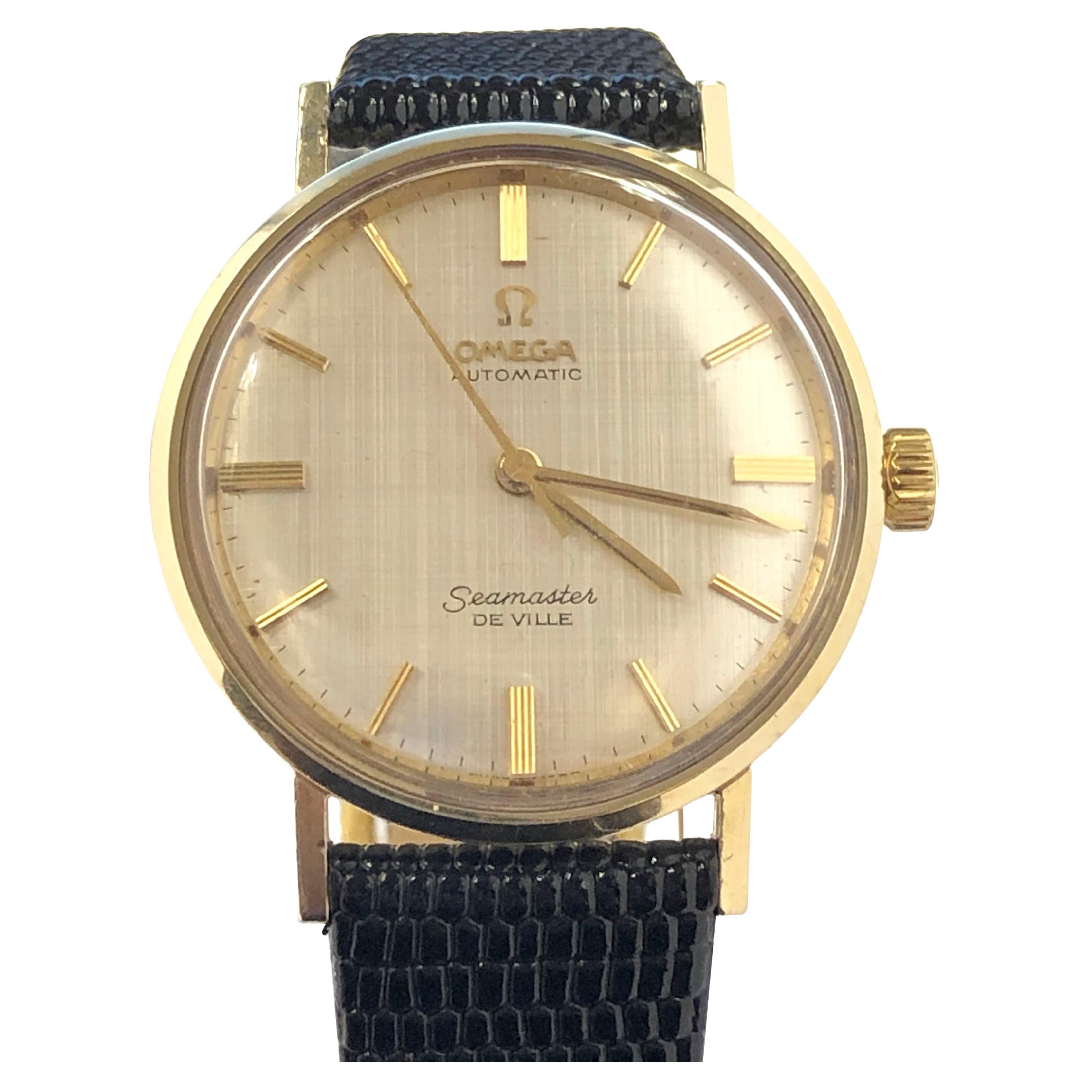 Circa late 1960s Omega Seamaster De Ville Wrist Watch, 34 M.M. 14k Yellow Gold 2 Piece Water resistant case with Seamaster Emblem on the case back. Caliber 550 24 Jewel , Automatic self winding movement. Beautiful mint condition Gold Linen dial with