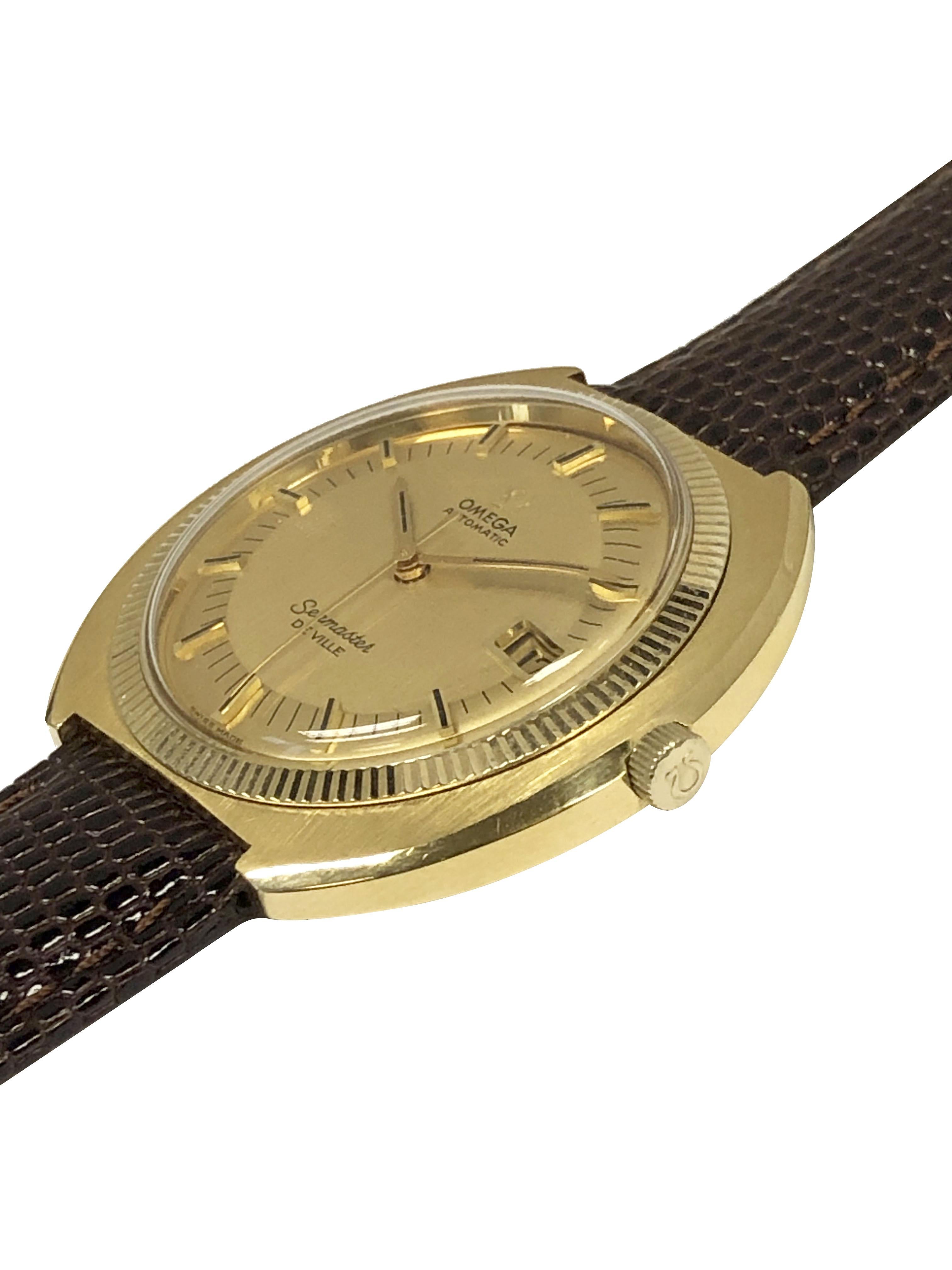Circa 1970 Omega Seamaster Deville Wrist Watch, 42 M.M. X 9 M.M thick 14k Yellow Gold filled 3 piece Cushion Case with Fluted Bezel. Caliber 563 17 Jewel Automatic, Self winding movement. Original and absolutely Mint condition Gold Satin Pie Pan