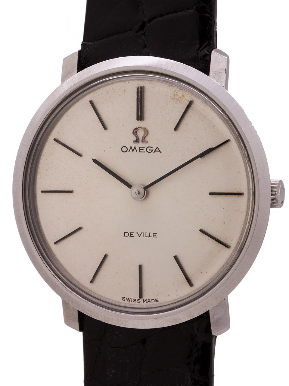 
Classic mid century design vintage man’s Omega stainless steel Deville ref # 111.077 circa 1970. Featuring a sleek and slim 33mm case with snap case back, acrylic crystal, and original matte silver dial with applied silver indexes and OMEGA logo,