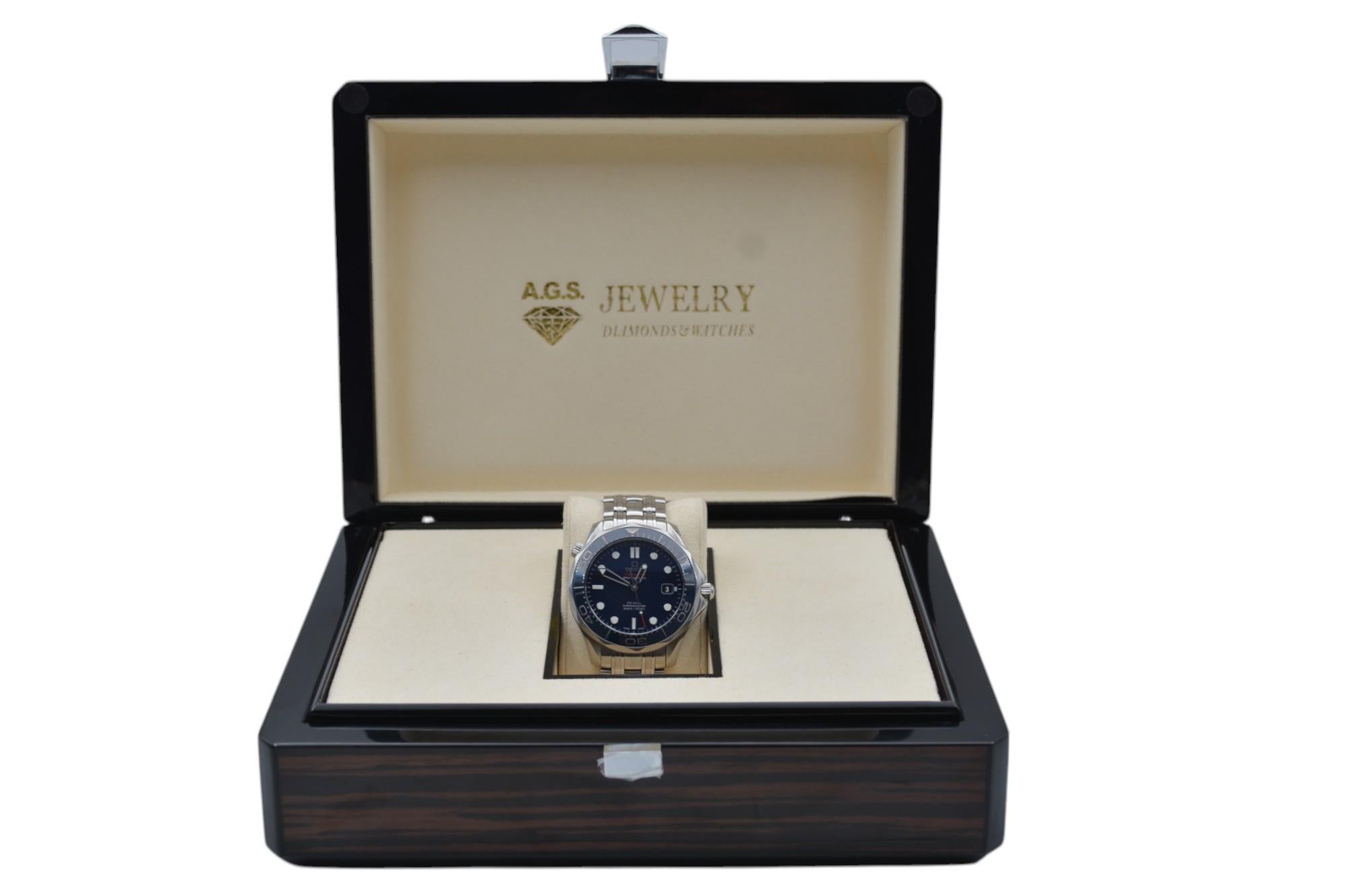 The watch is in a very good condition and it’s working well. It shows signs of wear and scratches. It has a scratch on the glass. The watch comes with an AGS Jewelry wooden box, along with an AGS Jewelry warranty card. For more information about
