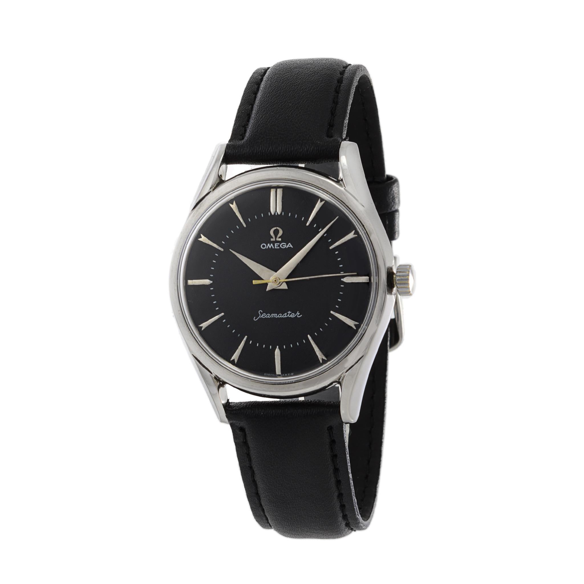 This is a jumbo Omega Seamaster Calatrava from 1956. At 36mm this watch was dramatically larger than most watches of the period. This watch is powered by a caliber 284 17 jewel manual wind movement. 

The dial of this watch is black with steel