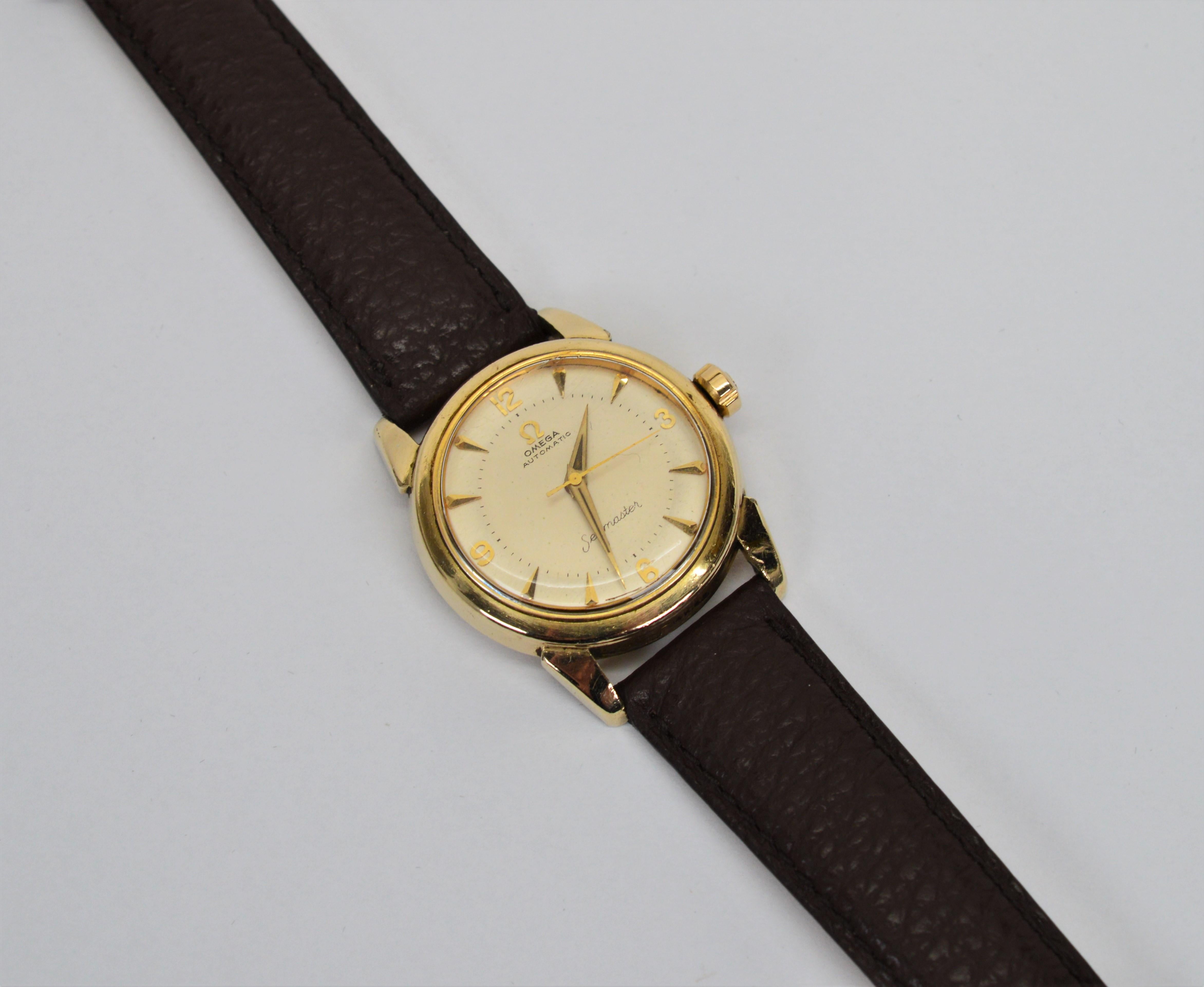 Circa 1950's, stylish and wildly popular, this men's Omega Seamaster Model 2823 Gold Filled Wrist Watch is a great find in its fine condition. Reliable, collectable and affordably priced this vintage timepiece has a case measurement of 32mm. The