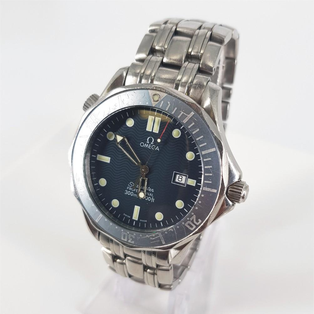Omega SeaMaster Watch - Quartz in Good condition. 
Model Number: 2541.80
Year: 2001
Stainless Steel Case measuring 41mm with a Navy Blue Dial & Stainless Steel Strap measuring 53mm.
