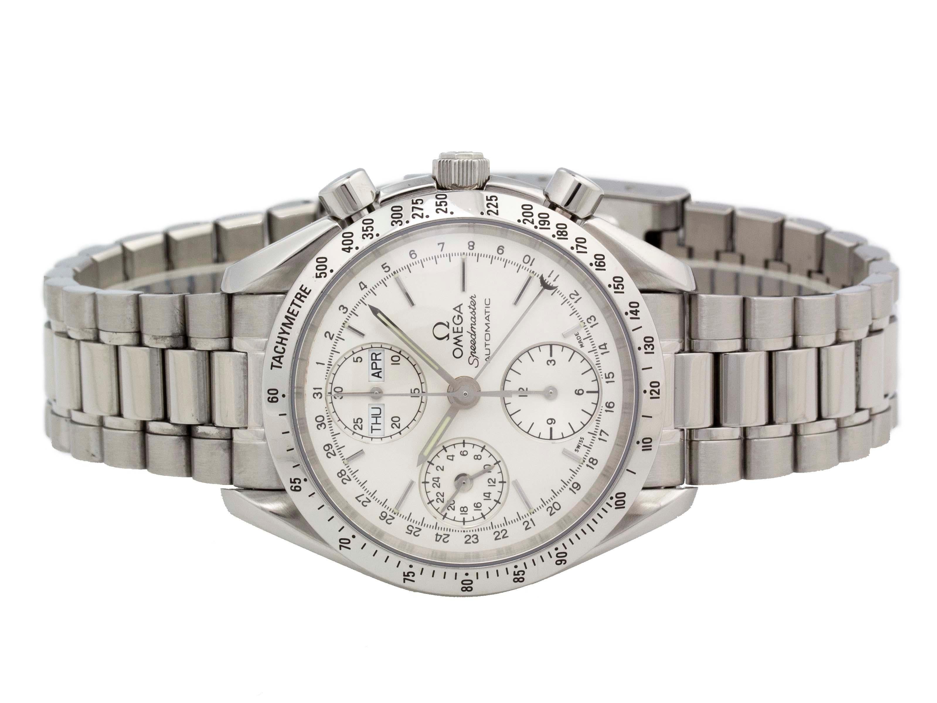 Stainless steel Omega Speedmaster automatic Watch with a 39mm case, silver dial, stainless steel bracelet foldover clasp. Features include hour, minute, second, day, month, and chronograph. Comes with Gift Box, Omega Manual, and 2 Year