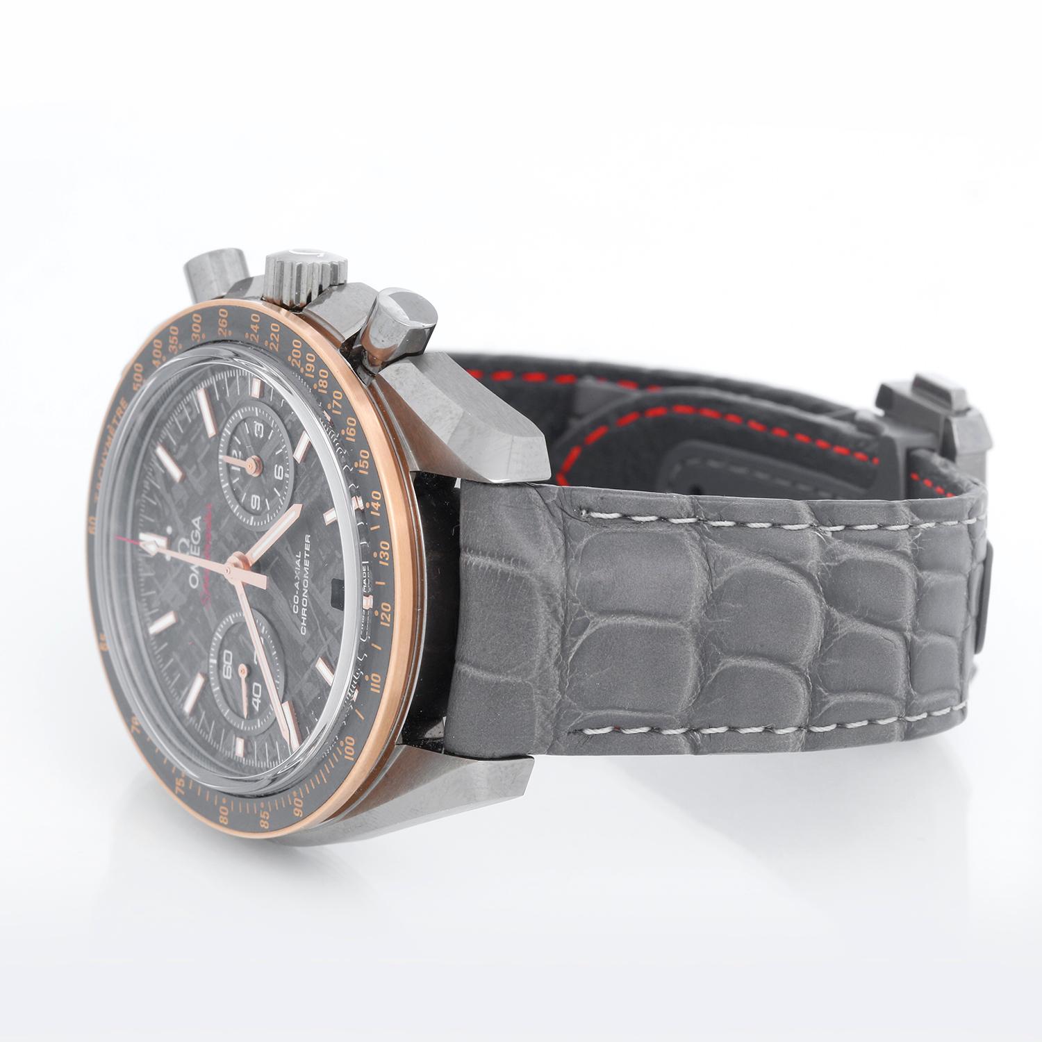 Omega Speedmaster Grey Side of The Moon  Watch 311.63.44.51.99.002 - Automatic winding. Grey ceramic with 18K gold bezel and brushed tachcymeter scale  (44.5mm diameter). Meteorite dial; 60-minute and 12-hour recorder at 3 o’clock and a small