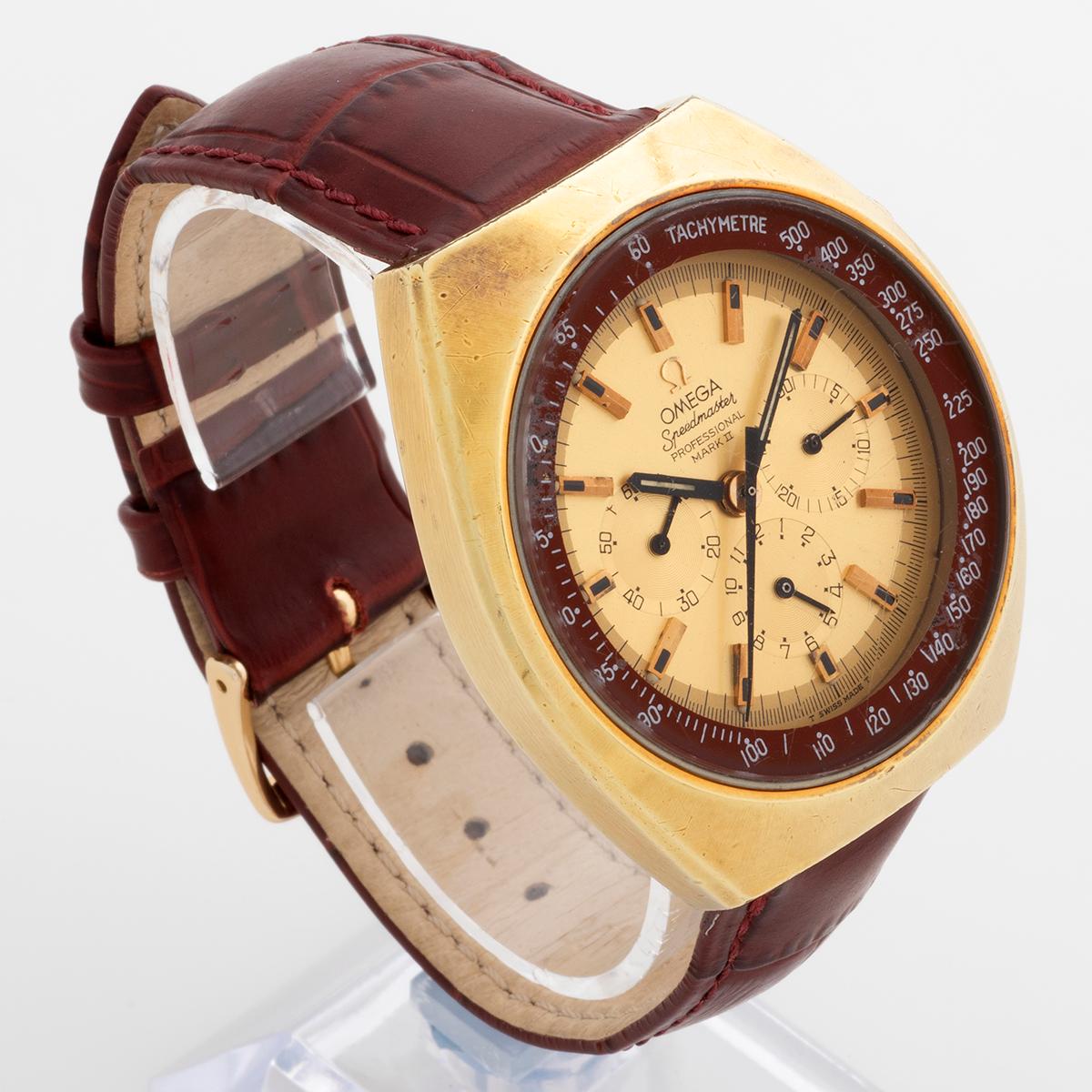 Our vintage and very rare Omega Speedmaster Mark II with cal. 861 movement features a 41.7mm heavy gold plated case with stainless steel case back, gold coloured dial and deep red/ brown tachy scale. This example is highly original with signs of use