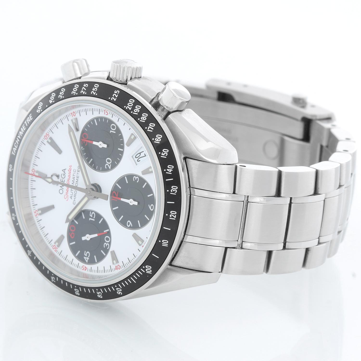 Omega Speedmaster Self-winding Chronograph 40mm Watch  - Automatic winding. Stainless steel case (40mm diameter). White Panda Dial with black and red markers. stainless steel Omega bracelet. Pre-owned with box and cards. 