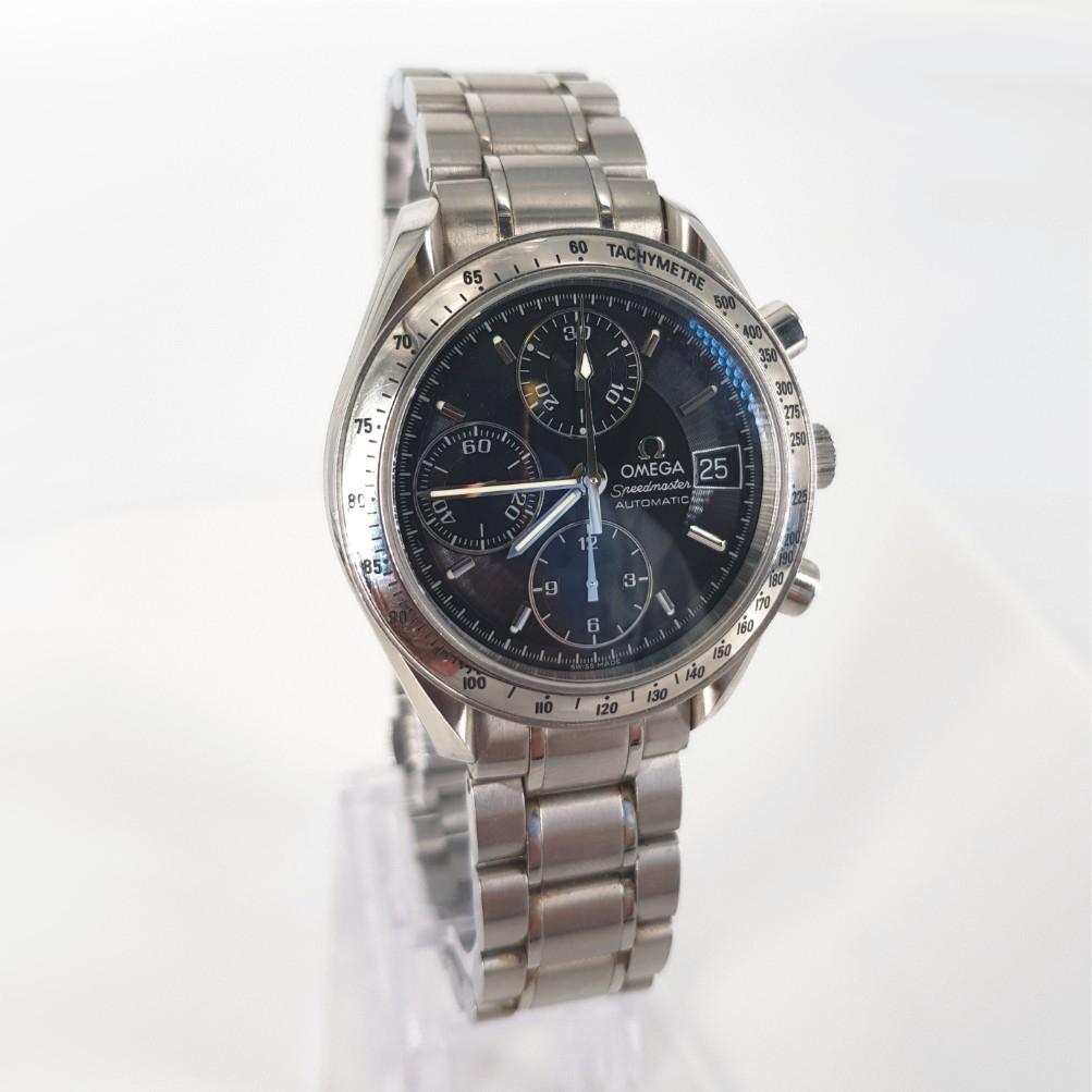 Omega Speedmaster Watch – Automatic in Excellent condition. 
Serial Number: 1152 & Model Number: 35135000 
Year: 2011
Stainless Steel Case measuring 36mm with a Black Dial & Stainless Steel Jubilee Strap measuring 60mm with Box & Papers
