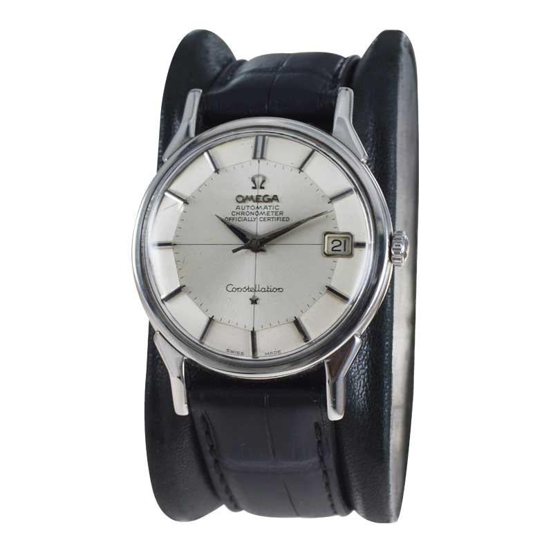 FACTORY / HOUSE:  Omega Watch Company
STYLE / REFERENCE: Round Constellation Chronometer 
METAL / MATERIAL: Stainless Steel 
DIMENSIONS: Length 43mm X Diameter 34mm
CIRCA: 1950's
MOVEMENT / CALIBER: Automatic Winding / 17 Jewels 
DIAL / HANDS: