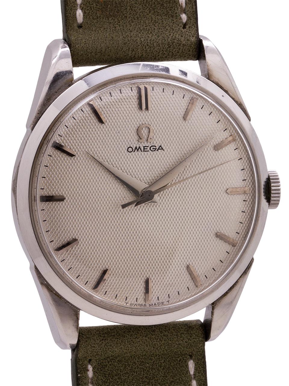 
Very clean design man’s vintage Omega manual wind ref# 25910-3SC, circa 1956. Featuring a large for the era 35mm diameter heavy stainless steel case with snap down case back. With a very pleasing original waffle texture silver satin dial with