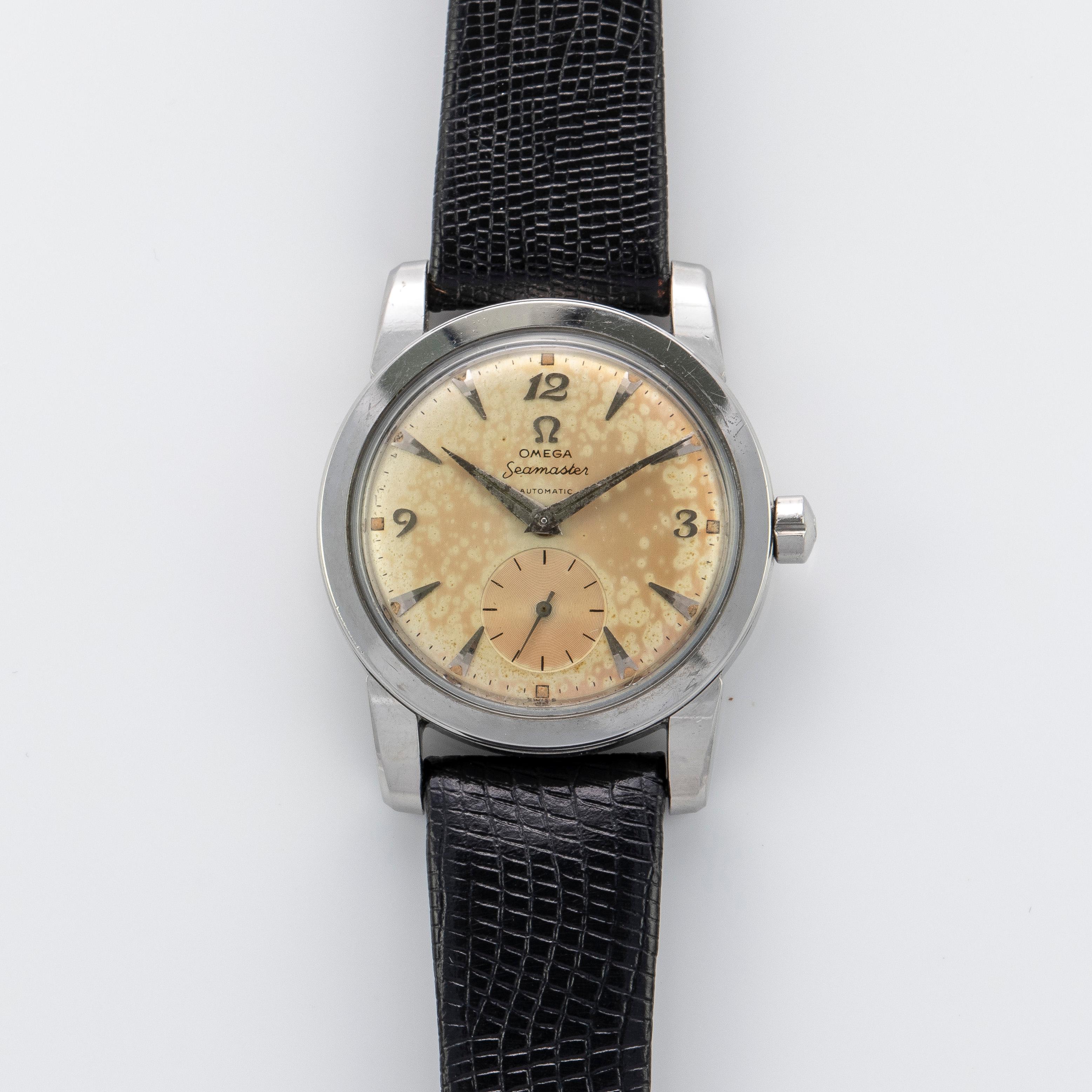 Stainless Steel Omega Seamaster Automatic Watch, 1950s
Tropical Dial with Applied Arabic and Dagger Hour Markers and Sub Second Dial at Six O'Clock
Stainless Steel Bezel
Stainless Steel Case
34mm in size 
Features Omega Automatic Bumper Movement