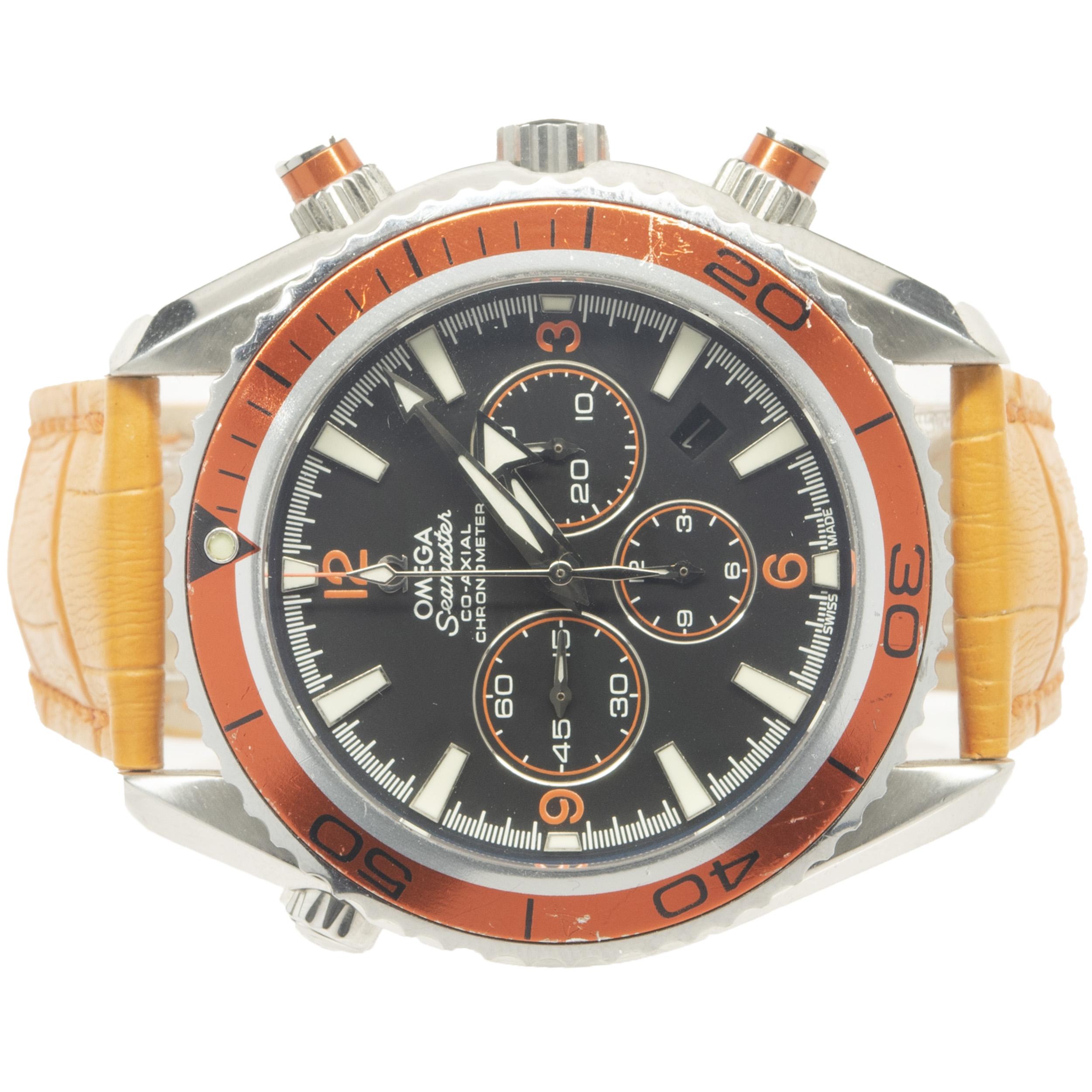 Brand: Omega
Movement: automatic
Function: hours, minutes, seconds, date, chronometer, helium escape valve
Case: 42mm round case, orange timing bezel, push/pull crown
Band: orange Omega leather strap, deployment clasp
Dial: black