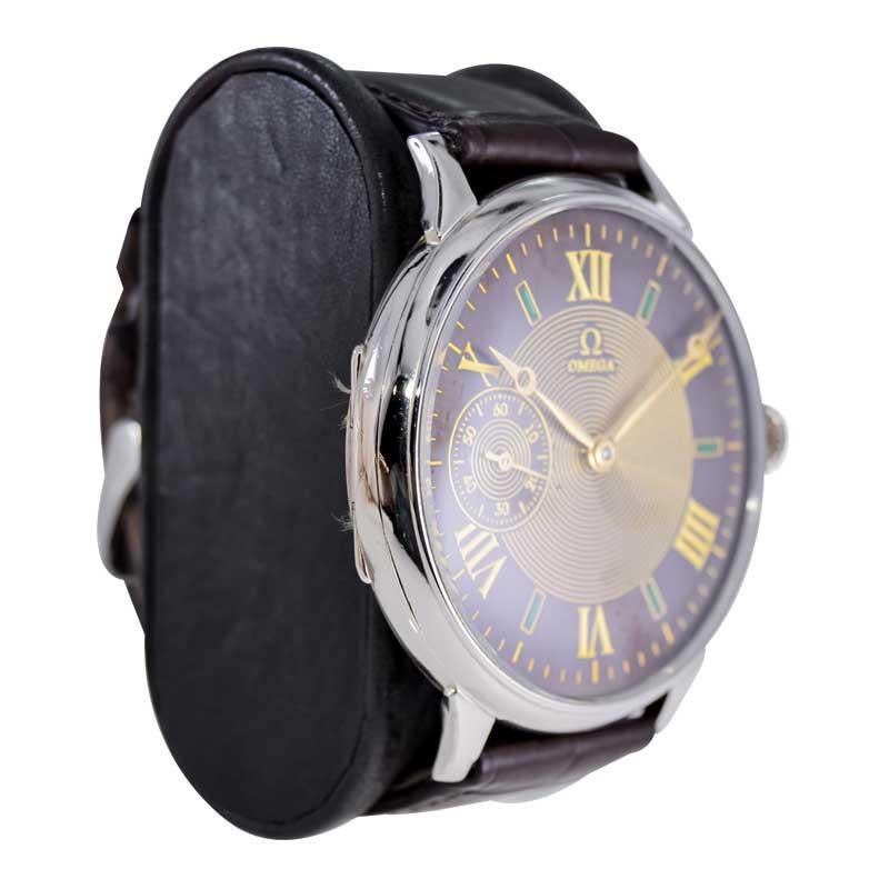 FACTORY / HOUSE: Omega Watch Company
STYLE / REFERENCE: Oversized Pocket Wrist Watch
METAL / MATERIAL: Nickel
CIRCA / YEAR: 1915
DIMENSIONS / SIZE:  Length 54mm X Diameter 47mm
MOVEMENT / CALIBER: Manual Winding / 15 Jewels 
DIAL / HANDS: Black and