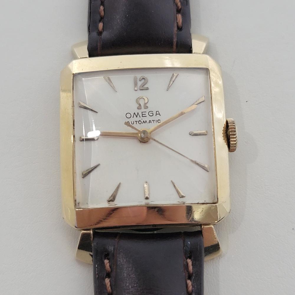 Classic luxury, 14k gold-filled Men's Omega rectangular automatic dress watch, c.1954, in excellent working condition. Verified authentic by a master watchmaker. Gorgeous Omega signed dial, applied dagger, baton and Arabic numeral 12 hour markers,