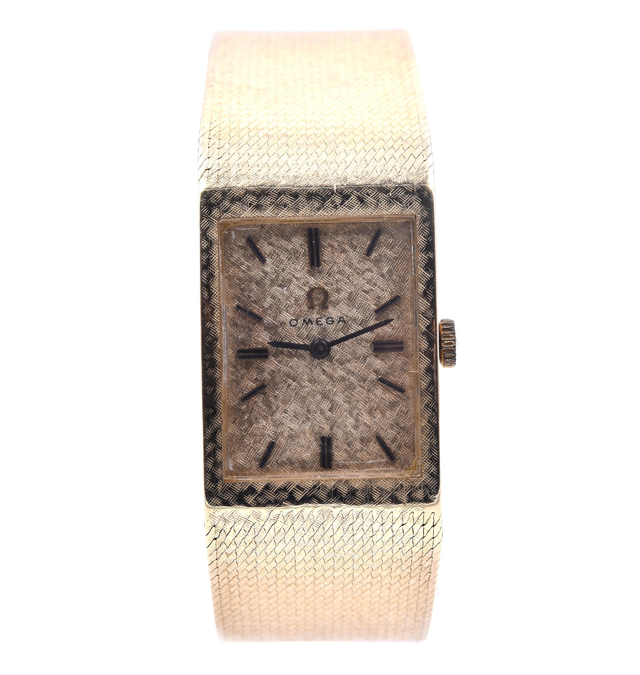 Movement: automatic
Function: hours, minutes
Case: 22x28mm 14k yellow gold integrated case, acrylic crystal
Band: 20mm wide 14k yellow gold integrated florentine band with gold buckle, will fit a 7 ½-inch wrist
Dial: gold dial, black hands and stick