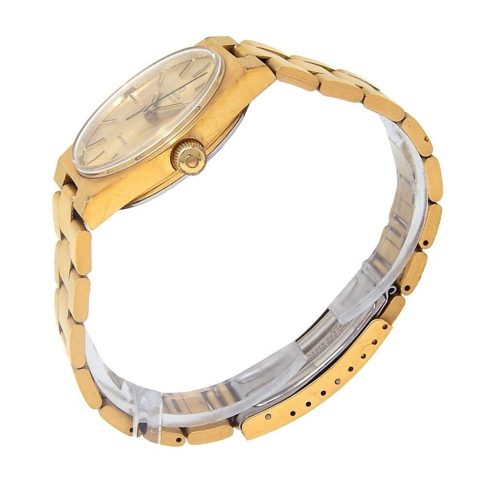 Brand: Omega
Band Color: Yellow Gold	
Gender:	Men's
Case Size: 32-35.5mm	
MPN: Does Not Apply
Lug Width: 23mm	
Features:	12-Hour Dial, Gold Bezel, Roman Numerals, Sapphire Crystal, Swiss Made, Swiss Movement
Style: Luxury	
Movement: Mechanical
