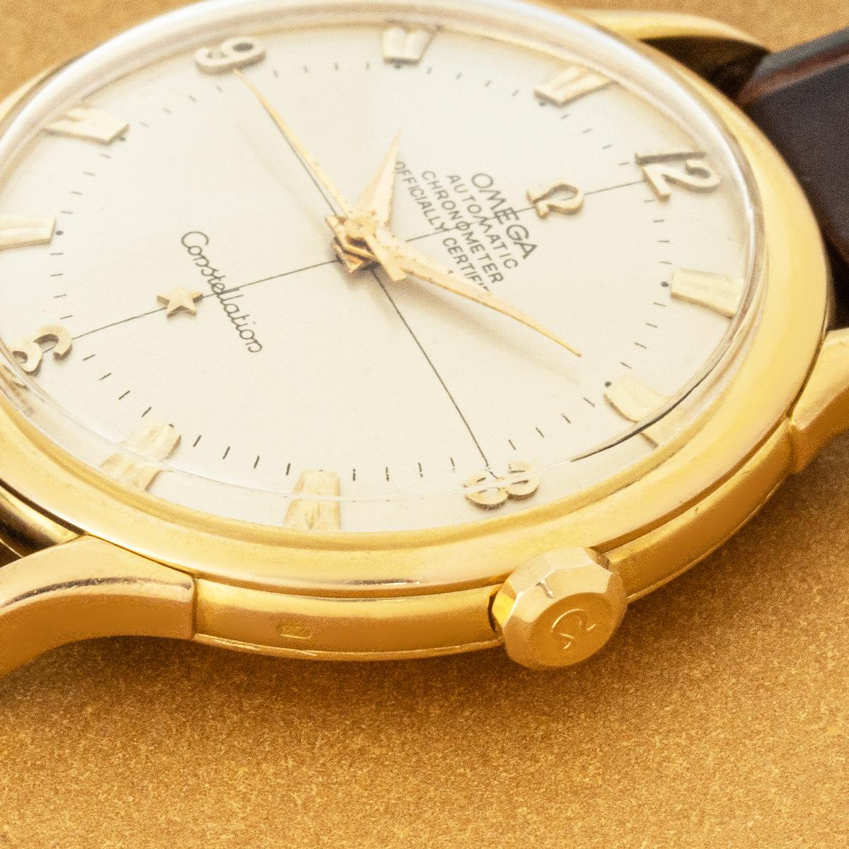 A vintage 35mm yellow gold Constellation by Omega. Features a silver dial, adorned with applied index batons and Arabic numerals at every quarter. Fitted with plastic glass and smooth bezel a new generic brown leather strap set with a generic gold