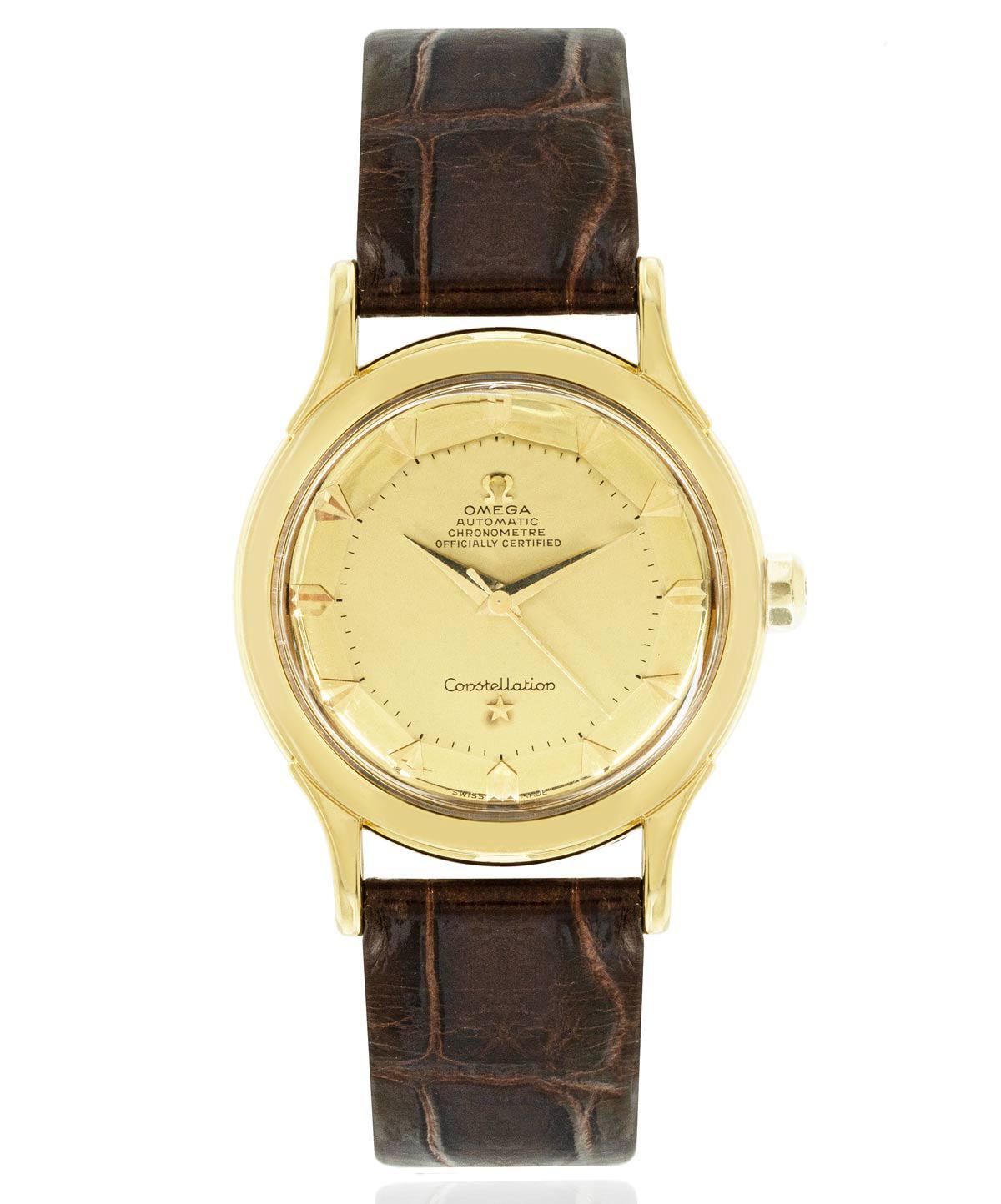 A vintage 36mm yellow gold Constellation by Omega. Features a champagne dial, complemented by a yellow gold smooth bezel. Fitted with plastic glass, an automatic movement, and a new generic brown leather strap set with a generic gold plated pin
