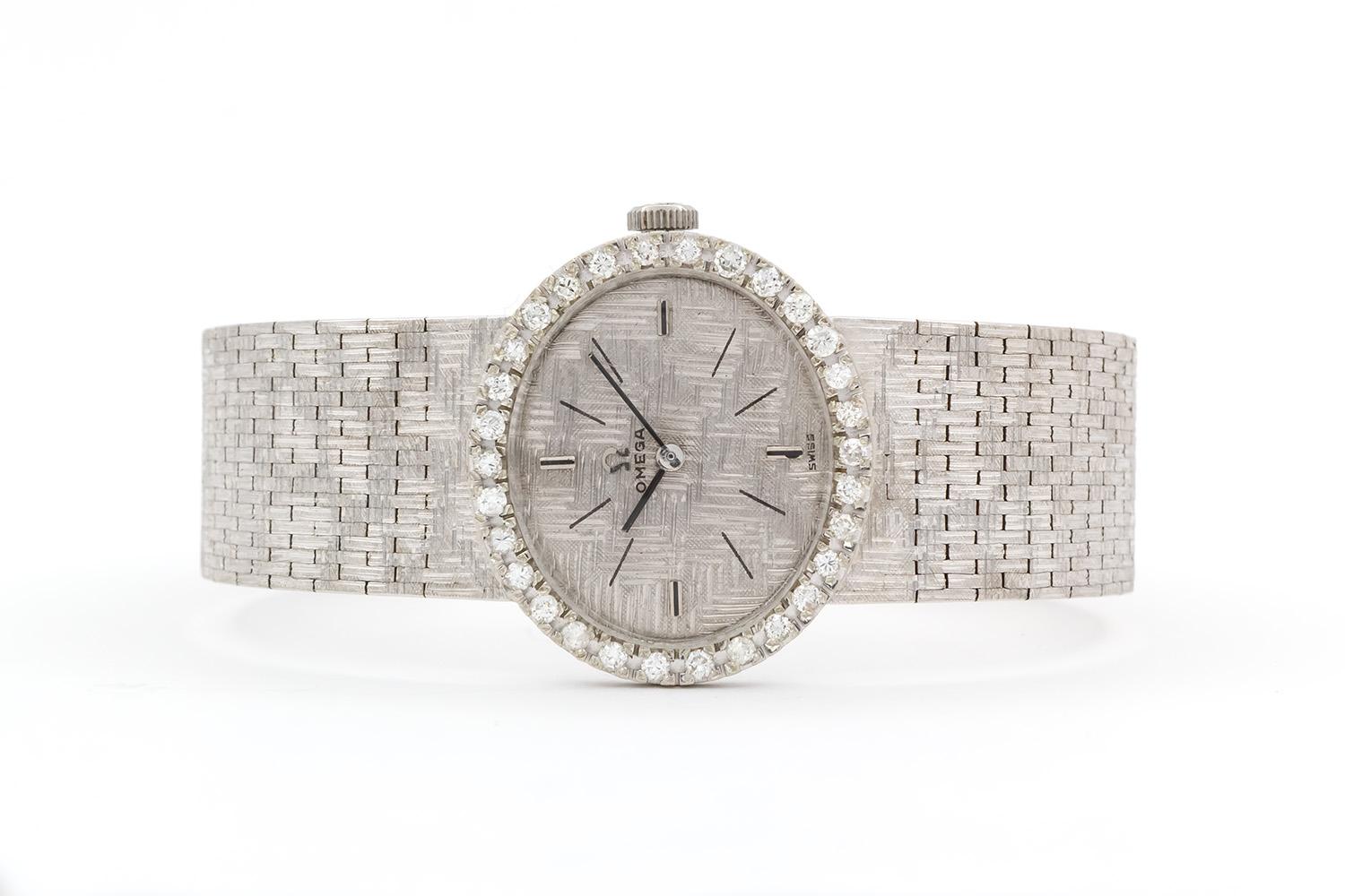 We are pleased to offer this Omega 18k White Gold & Diamond Vintage Lady's Mechanical Wind Dress Watch. These timepieces are characterized by pure styling with luxury finishes, and exude a timeless design. This vintage model features an 18k white