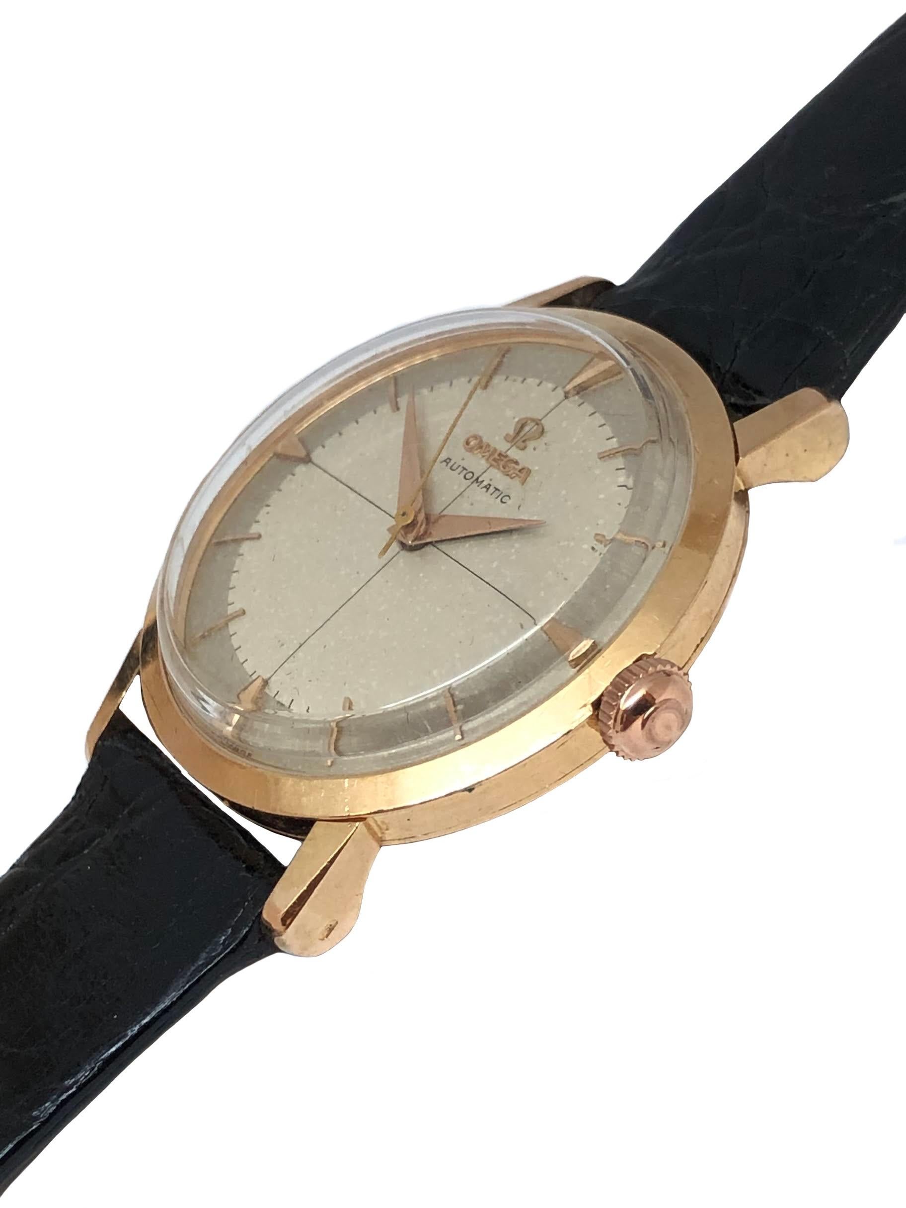 Circa 1950s Omega Wrist Watch, 34 M.M. 18K Rose Gold 3 Piece Case with slight Tear drop lugs. Caliber 501, 17 Jewel Automatic Self Winding Movement. Original, Excellent Silver Satin Dial with Raised Rose Gold markers and Rose Gold Hands and a Sweep