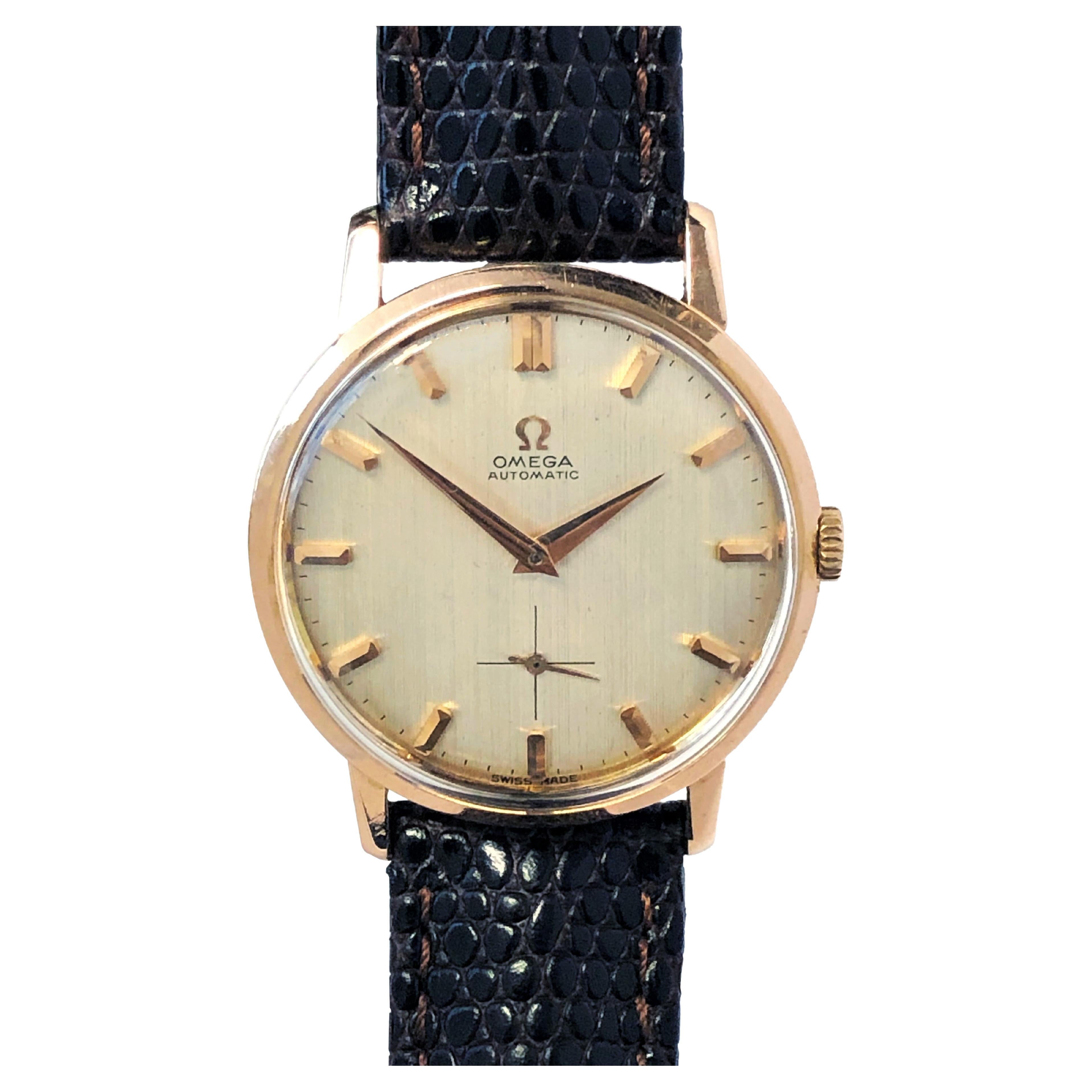 Circa 1950 Omega Wrist Watch, 34 M.M. 18k Rose Gold 3 piece case with scrolled down lugs. original and Mint condition Gold Satin Linen Dial with raised Rose Gold markers. Caliber 491, 19 jewel Automatic, Self winding movement.  New Brown Lizard