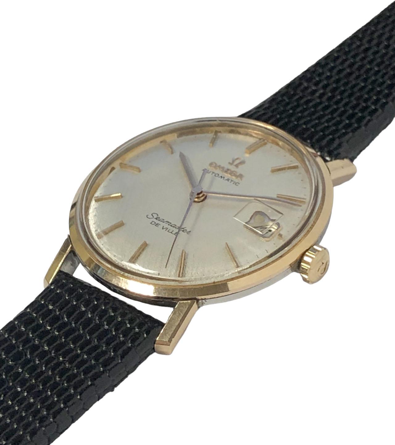 CIRCA 1960er Omega Seamaster De Ville Armbanduhr, 34 M.M. Edelstahl und Rose Gold 2 Stück wasserdichtes Gehäuse, 17 Jewell, Kaliber 550 Automatik, Selbstaufzug Bewegung. Original Mint Zustand Silber Satin Leinen Zifferblatt mit erhöhten