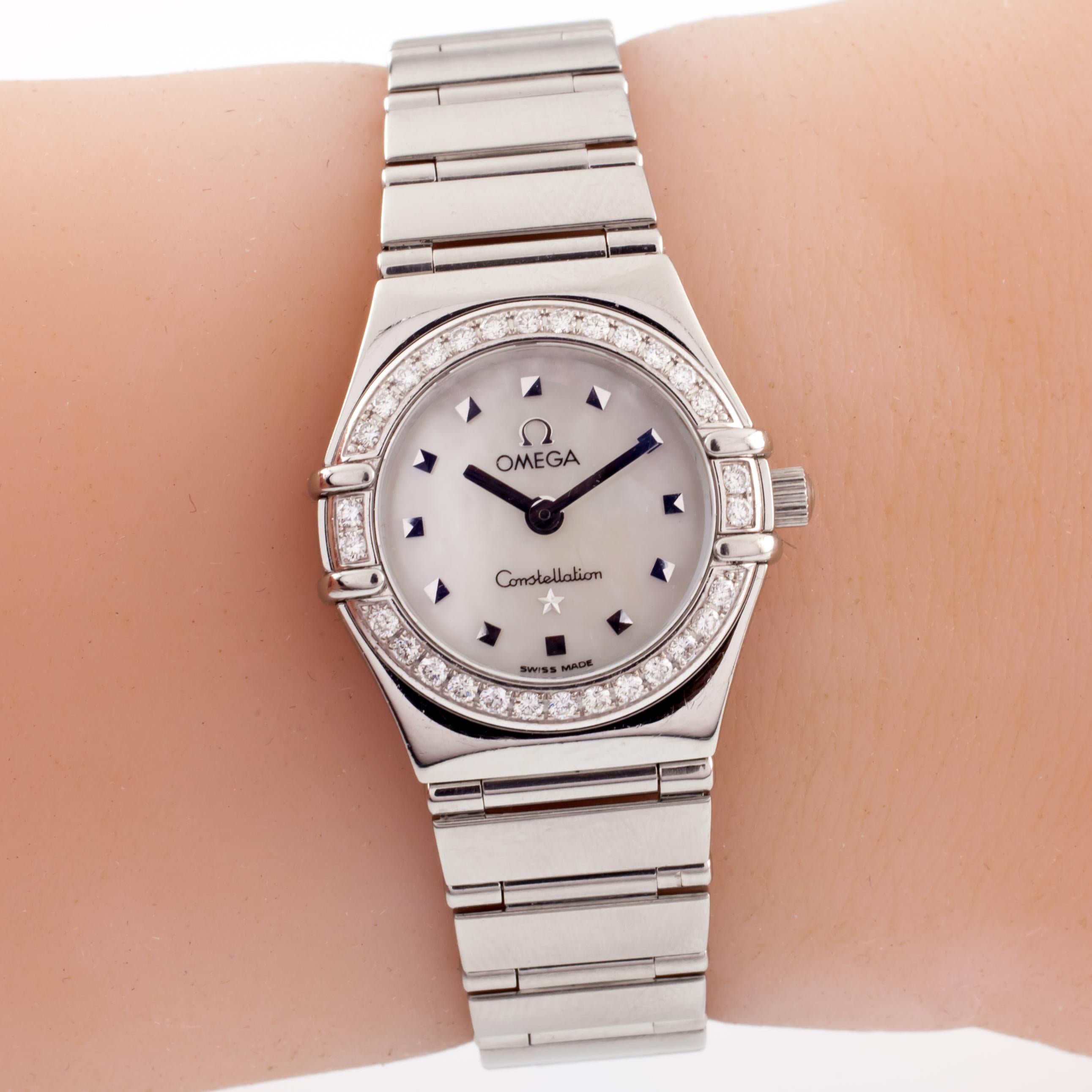 Movement #1456-976001

Case #55978740

Stainless Steel Case w/ Diamond Bezel

22 mm in Diameter (24 mm w/ Crown)

Lug-to-Lug Distance = 27 mm

Lug-to-Lug Width = 14 mm

Thickness = 7 mm

Mother-of-Pearl Dial w/ Silver Tic Marks and Hands (M + H)

16