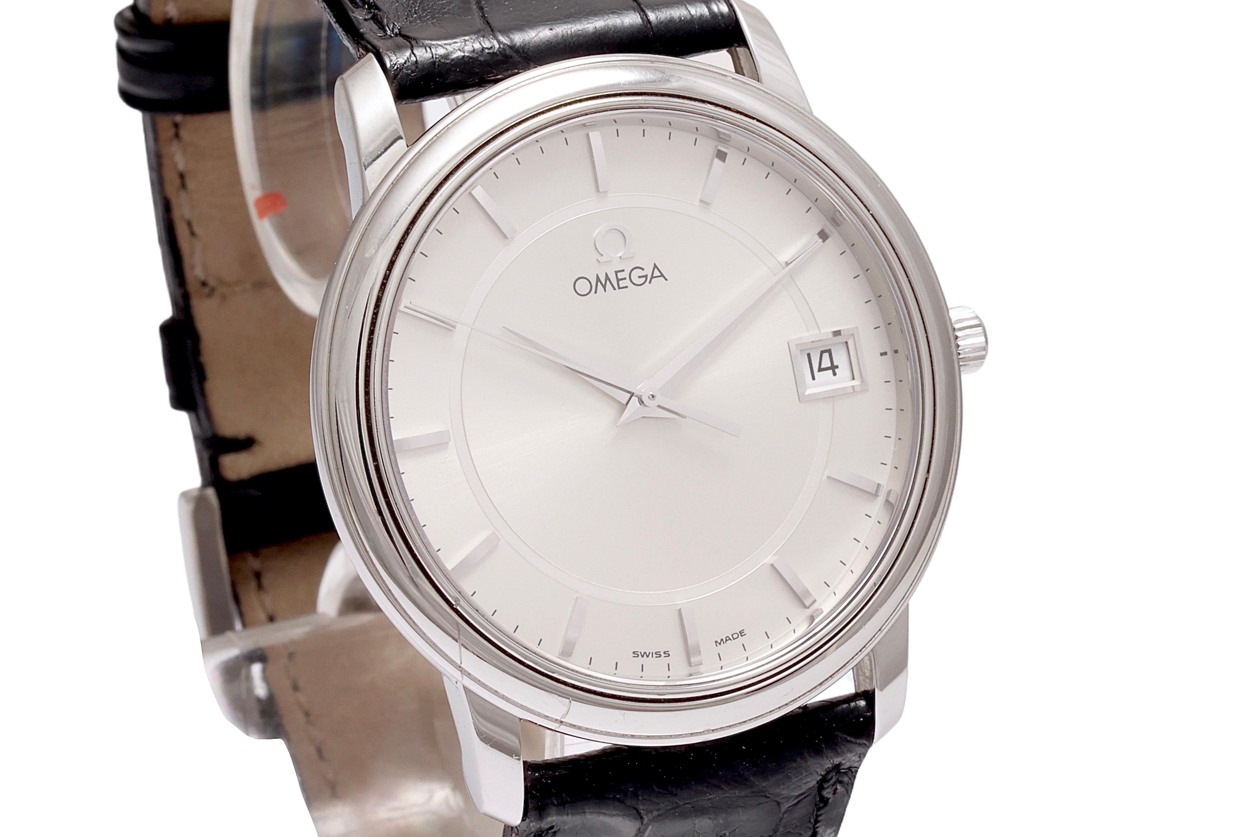 Omega Wristwatch, Steel, Quartz, Top Condition

Movement: Quartz

Case: Steel, Diameter 34.3 mm, thickness 5.9 mm

Dial: Silver dial with applied silver hour markers, date window at 3 o'clock

Strap: Original Omega black leather with Omega buckle,